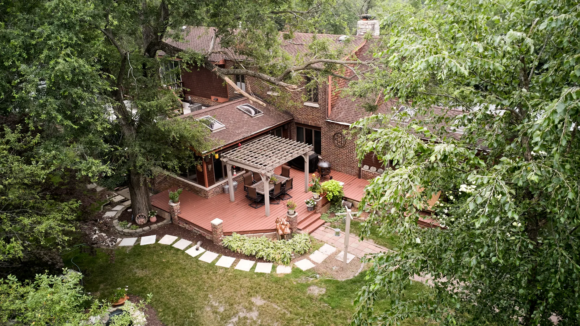 Wood deck with pergola overlooking the wooded backyard of 3708 Cooper Place
