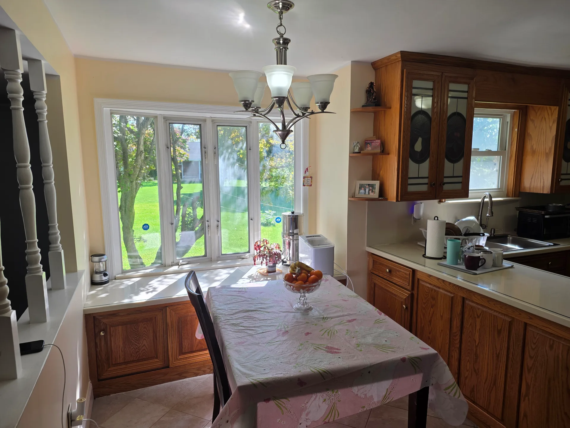 Kitchen eat-in area with a window over the backyard