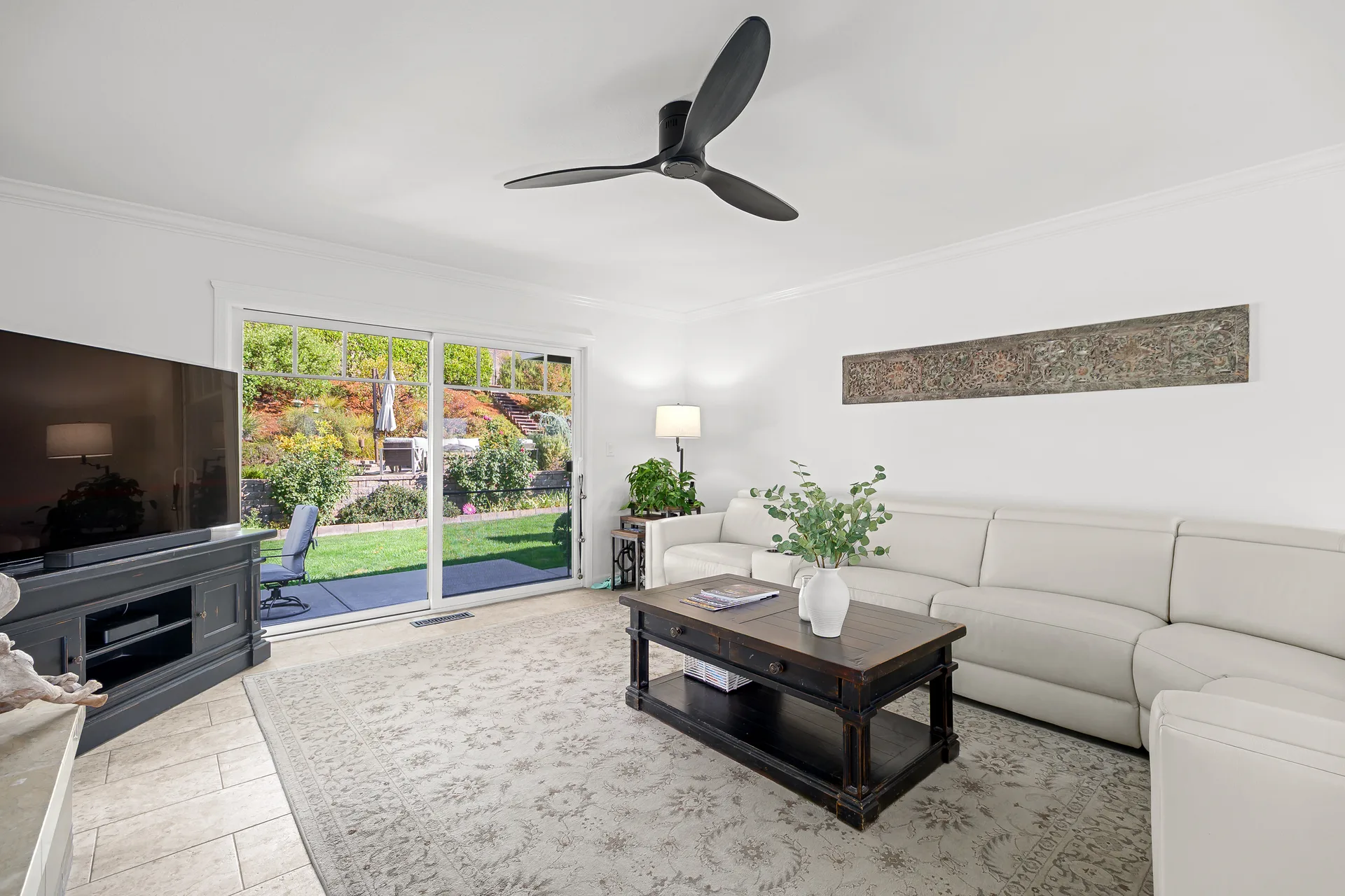 Bright living room with sliding glass doors opening to the patio