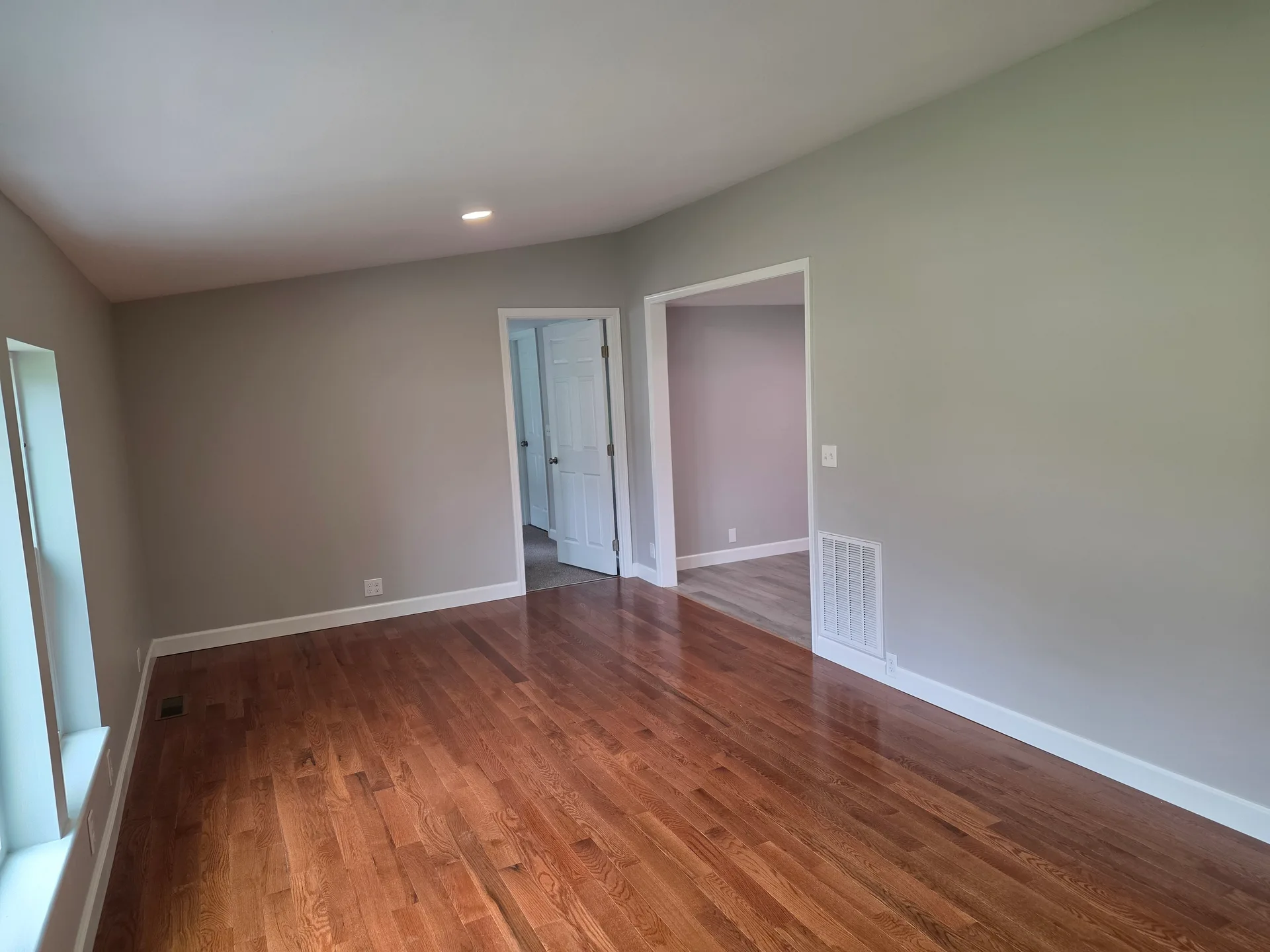 Bright, simple living room with light grey walls
