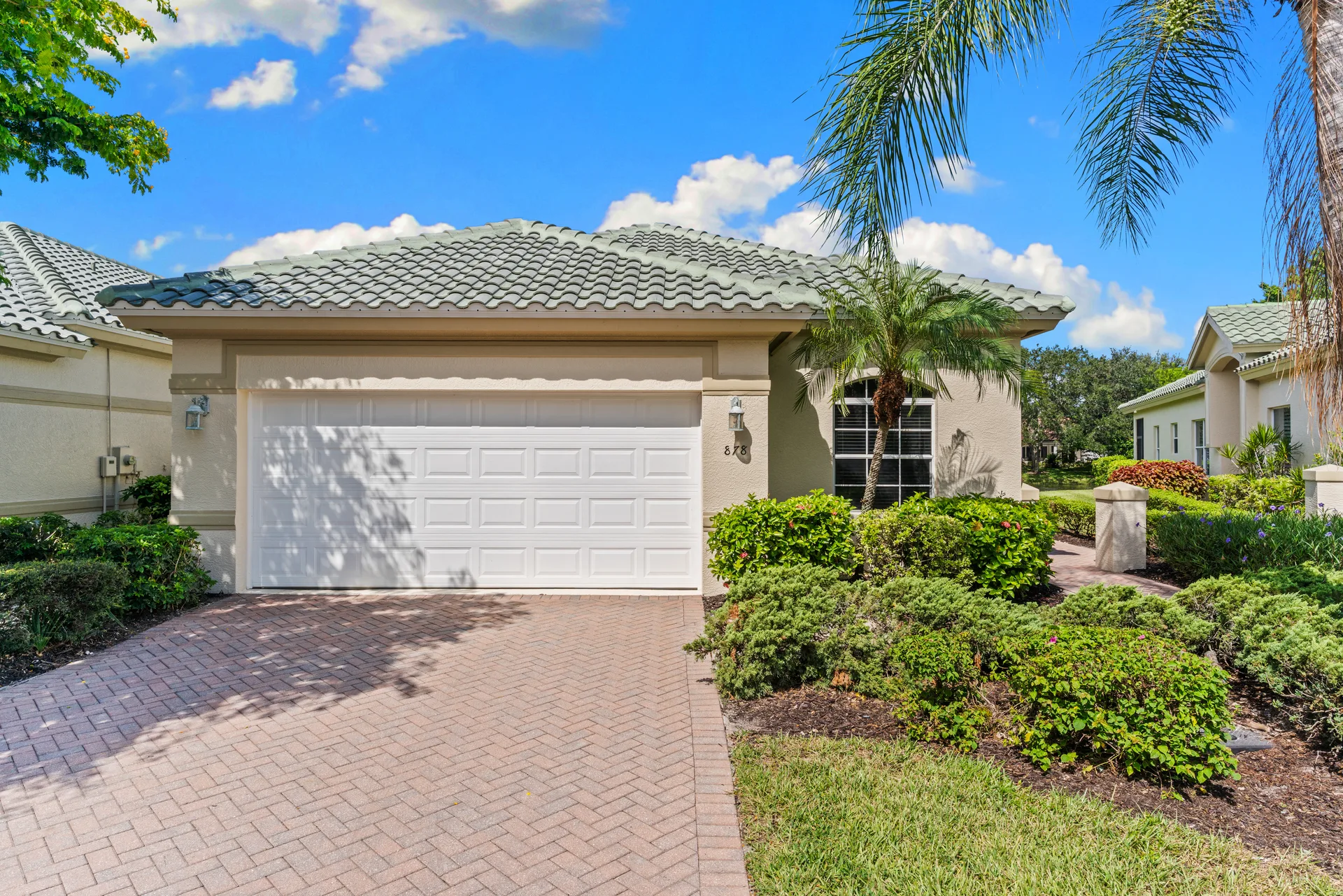 Exterior front facade of 878 Vistana Circle in the Vineyards Naples FL