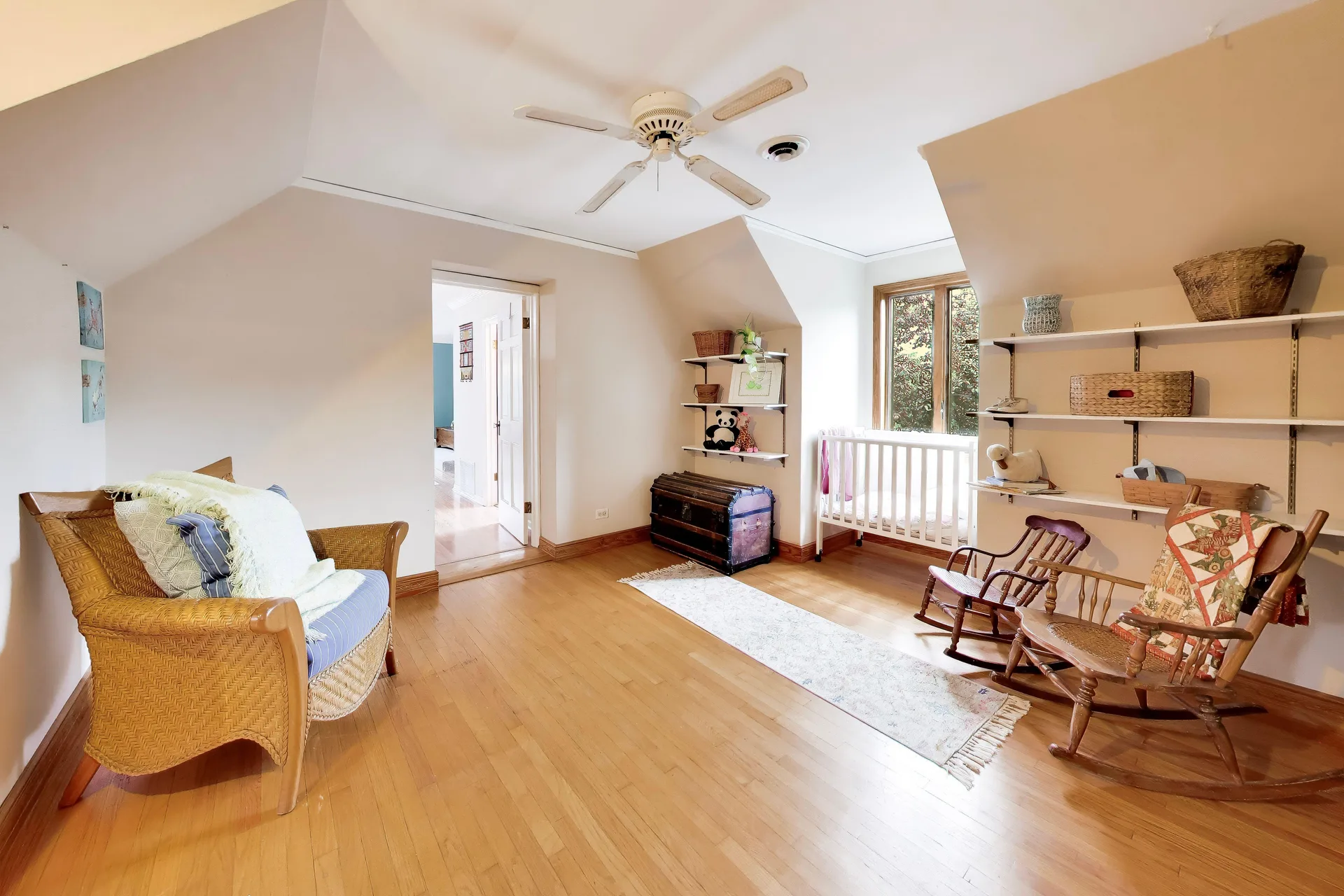 Bedroom with sloped ceiling and a large window