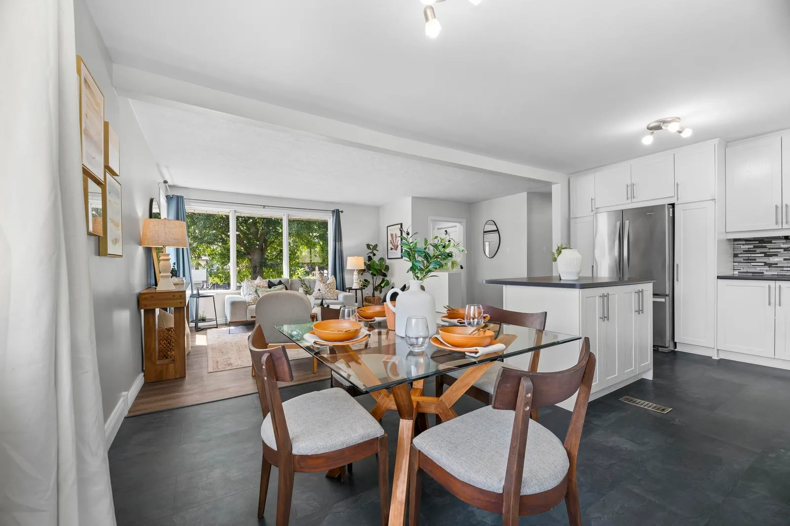 Dining area adjacent to the kitchen with stainless steel appliances