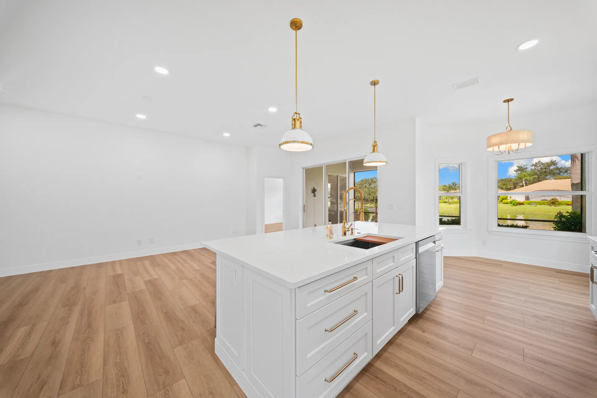 Kitchen and open living space with sliding glass doors
