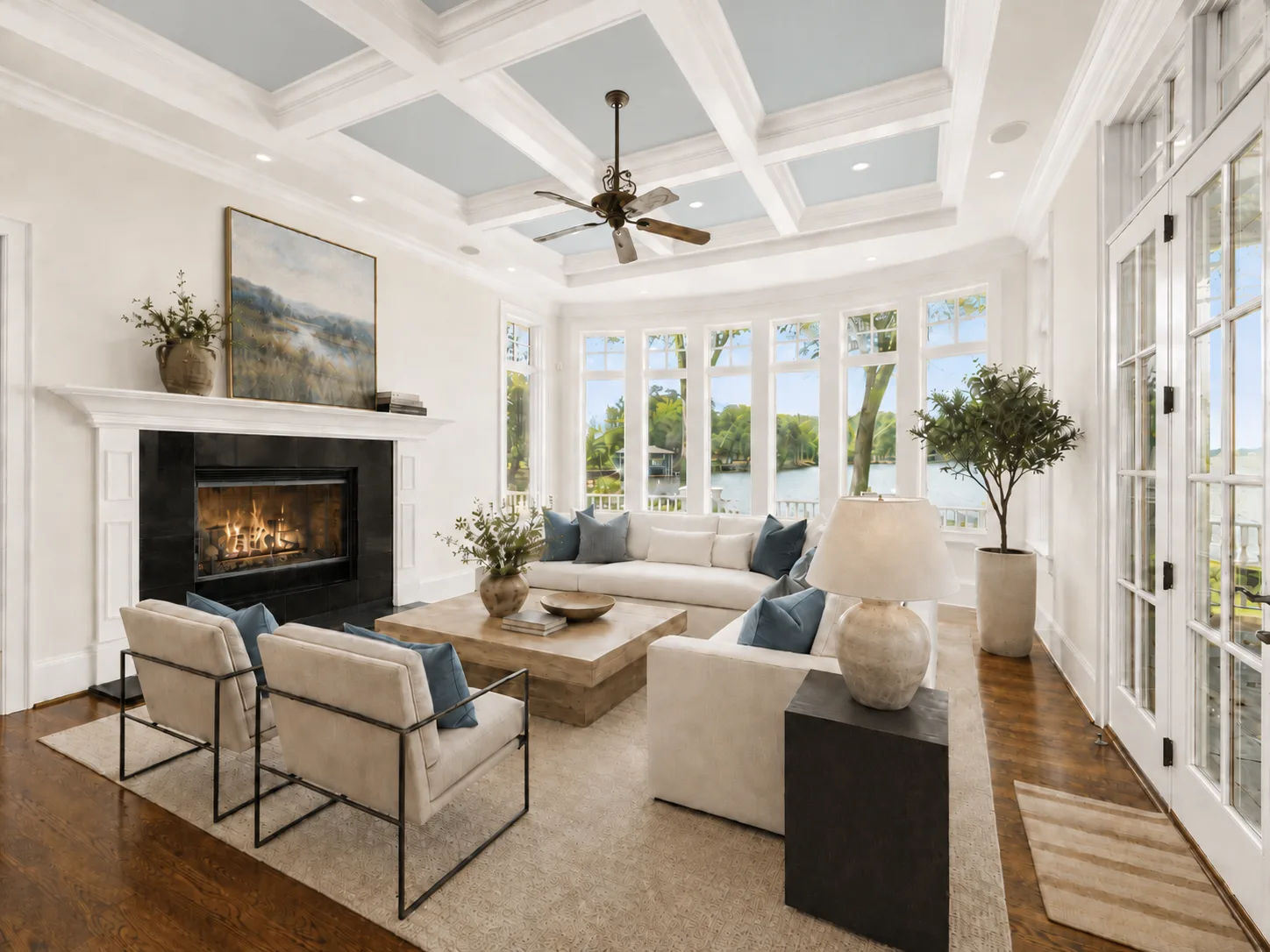 Living room with coffered ceiling and lake view