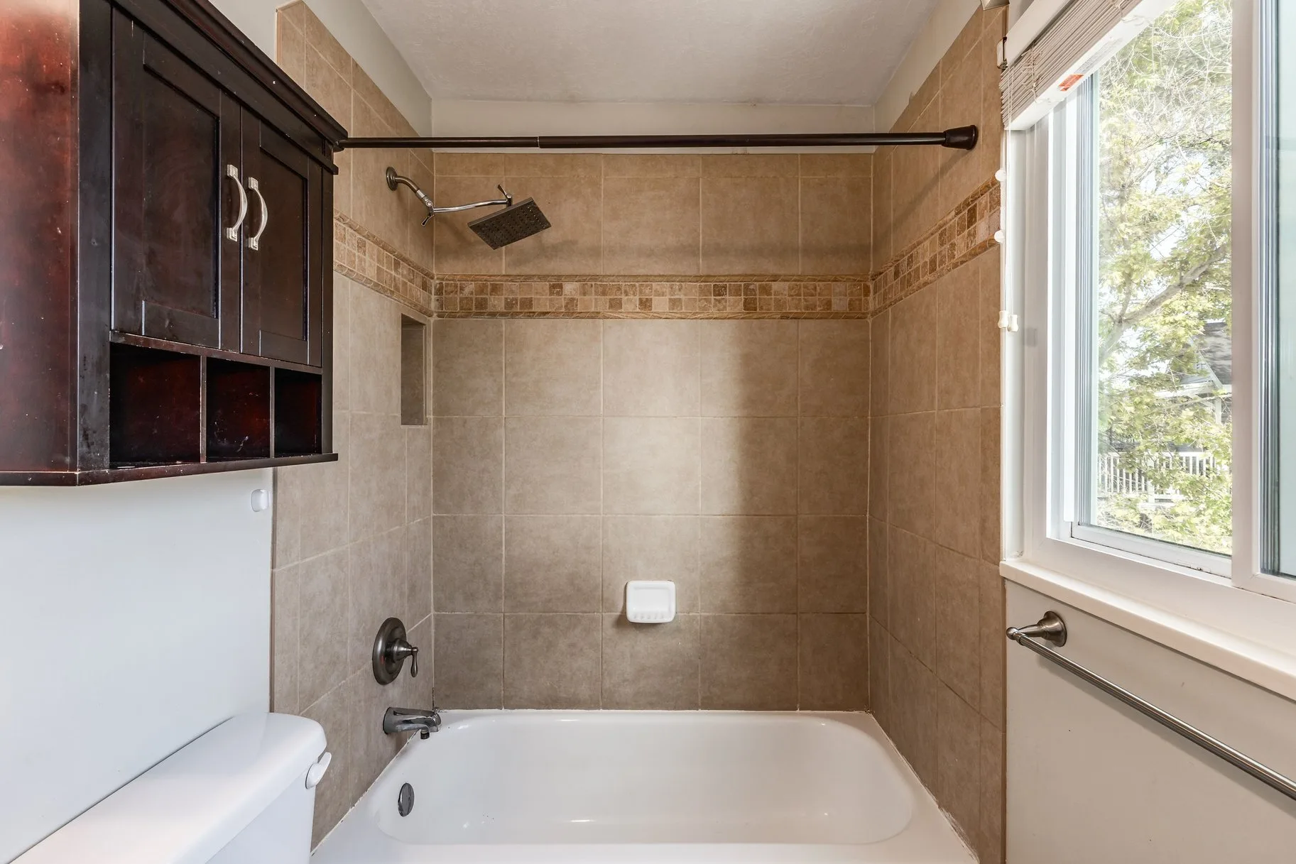 Bathroom tub and shower with ceramic tile surround