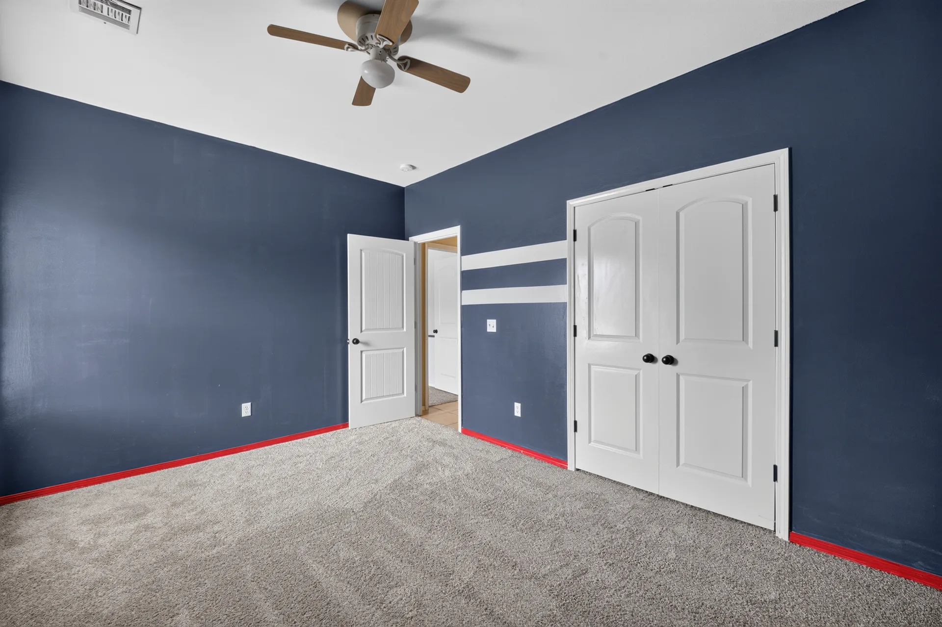 Bedroom with blue accent walls