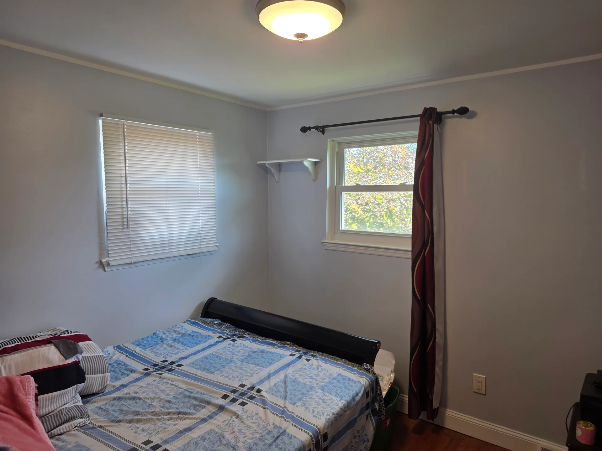 Guest bedroom with hardwood floors
