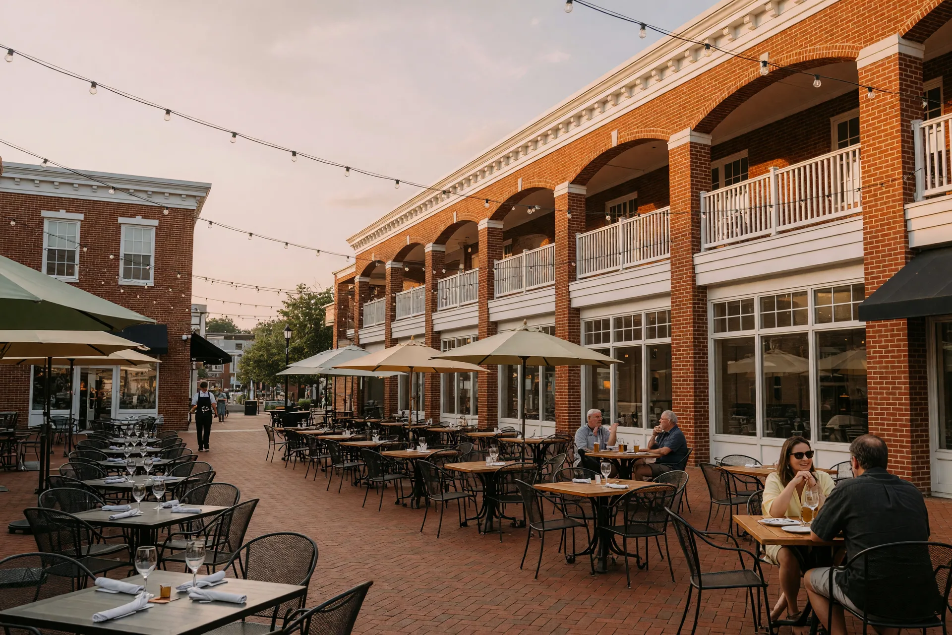 Bright daylight view of a lively dining and shopping scene in downtown Rockville