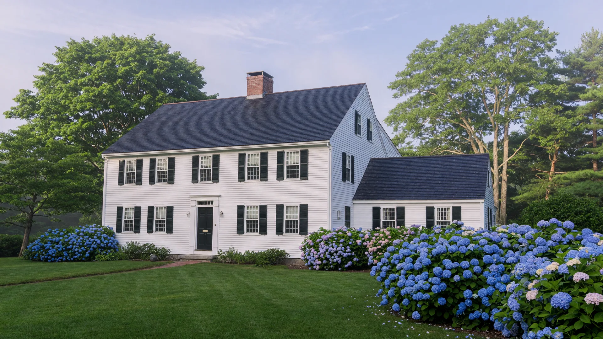 A classic New England home on the North Shore, the hero image for this tour of saltbox, colonial, and shingle-style houses