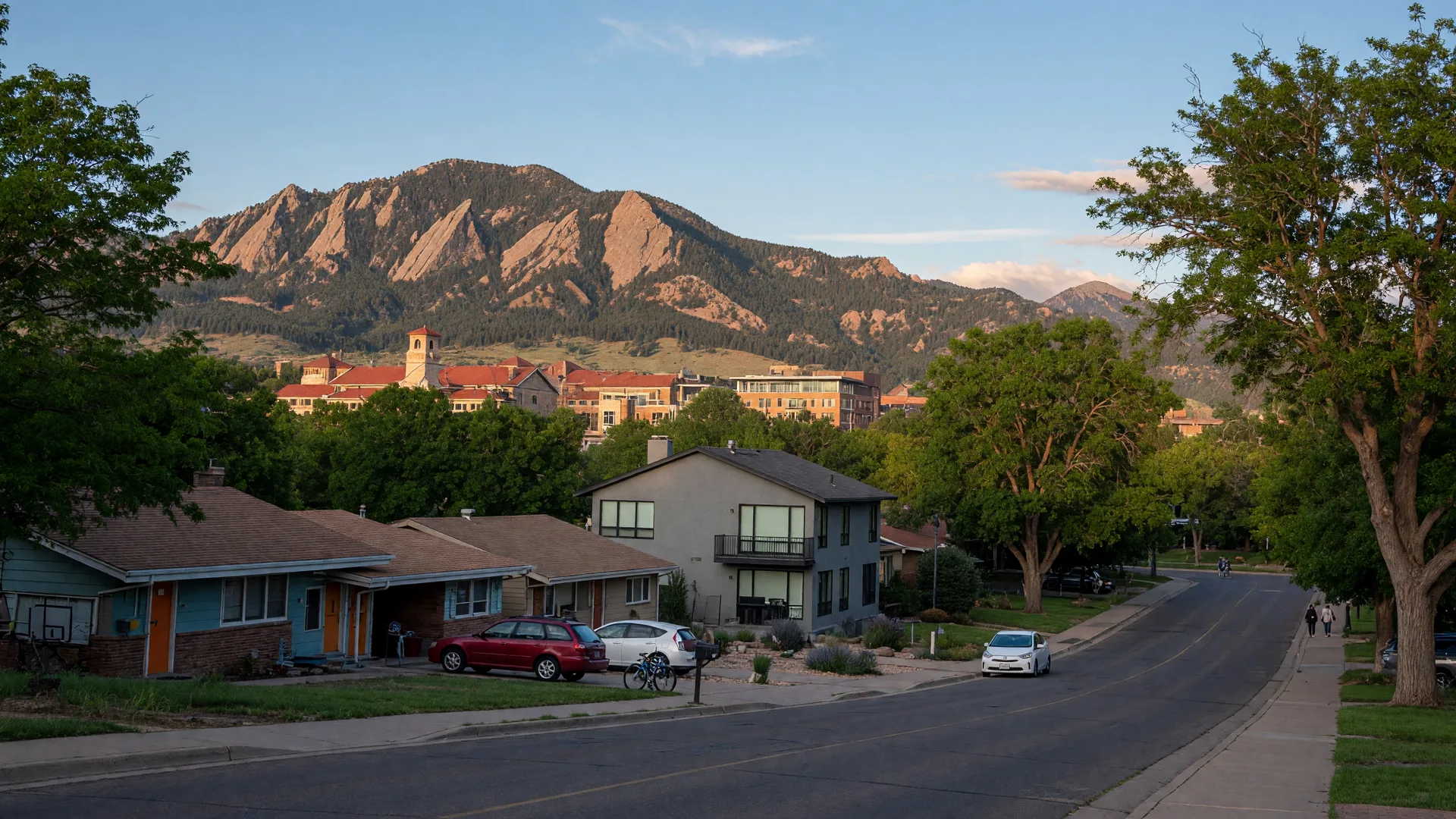Mid-century homes and newer construction in University Hills near CU Boulder campus with Flatirons backdrop