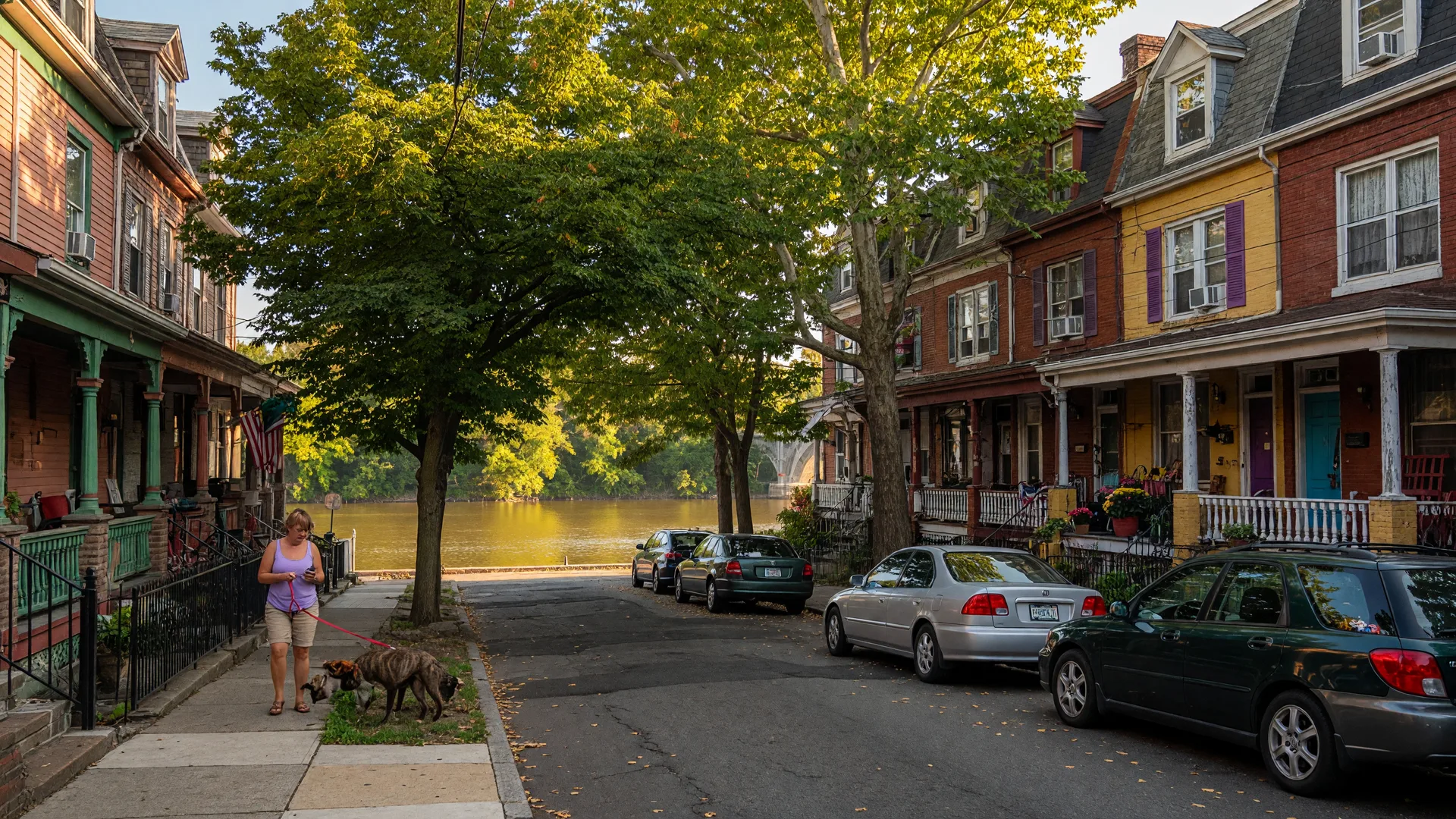 Victorian twin homes and rowhouses on a tree-lined street in East Falls, Philadelphia