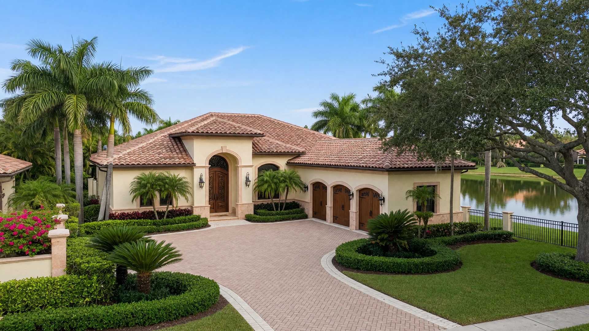 Exterior of the single-story lakefront home at 16740 Strasbourg Lane in Seven Bridges, Delray Beach