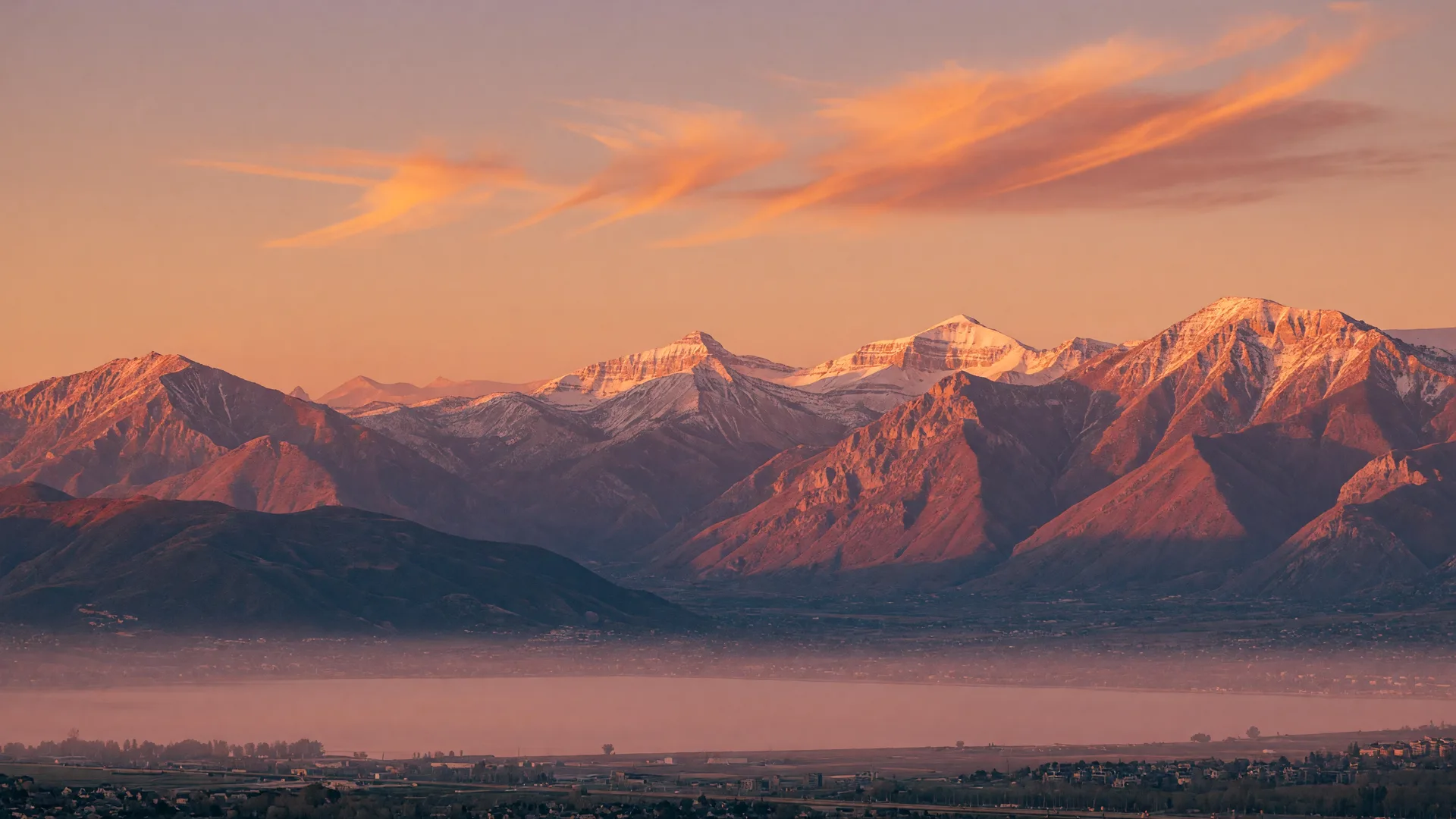 The Wasatch mountains glowing at golden hour above the Saratoga Springs valley