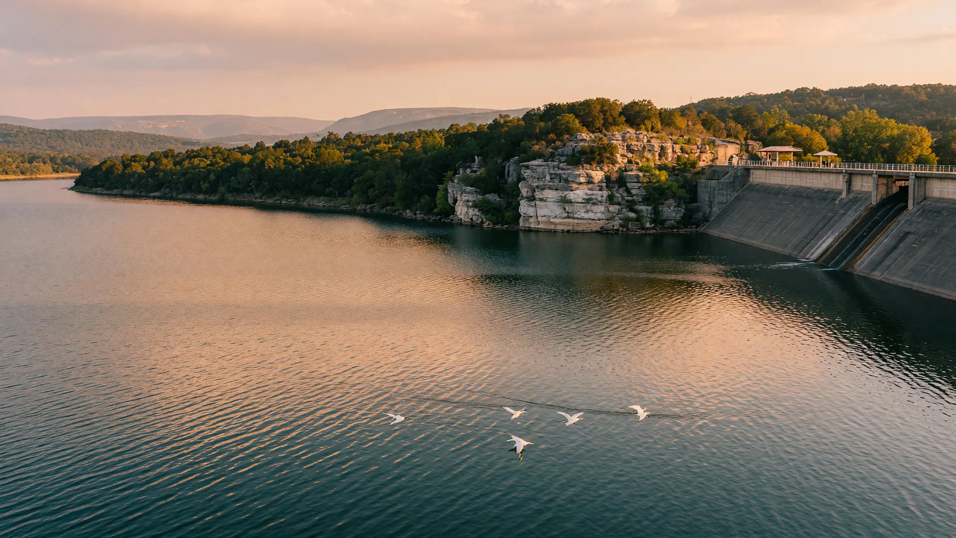 Lake Belton at golden hour with limestone bluffs and the distant dam overlook