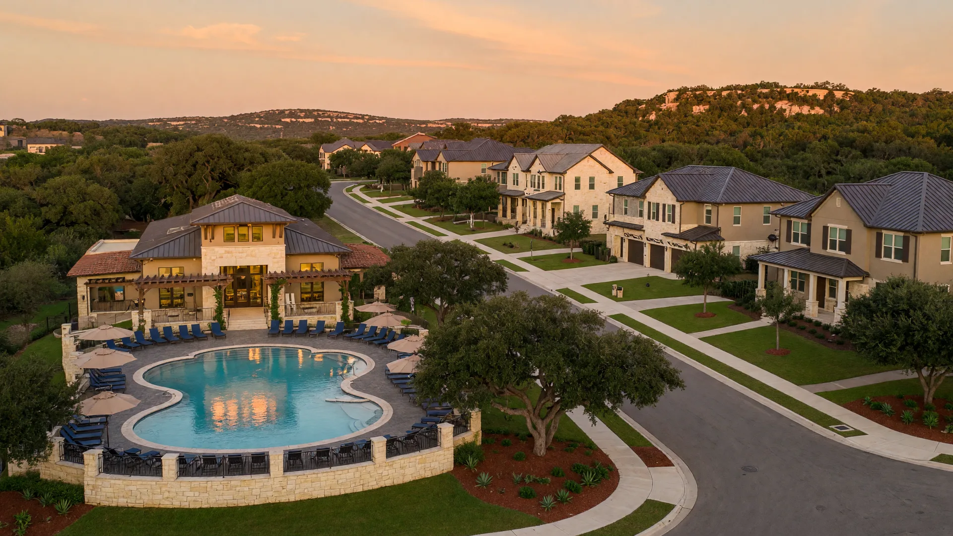 Balcones Creek master-planned community in Boerne, Texas with modern homes, mature oak trees, and a resort-style pool