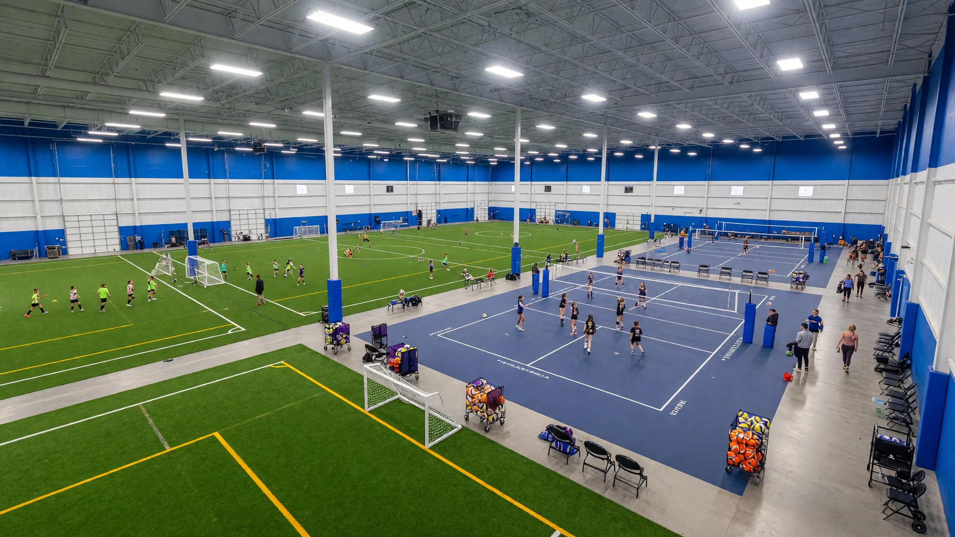 Inside Pinnacle Sports in Medina, Ohio, a spacious indoor athletic complex with multiple soccer fields, volleyball courts, and bright LED lighting