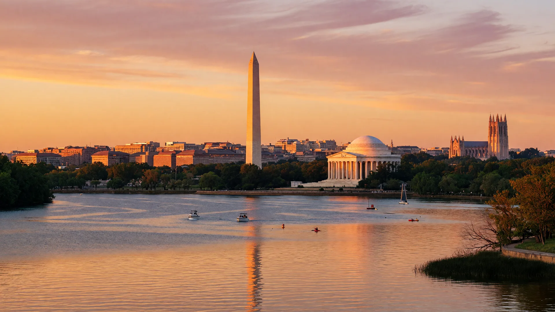 Washington DC skyline at golden hour from the Potomac River, with the Washington Monument and Jefferson Memorial visible