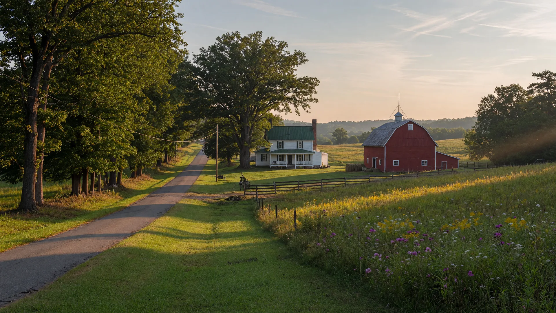 Peaceful rural landscape in Caroline County, Virginia with farmland, country road, and historic farmhouse on a late summer afternoon