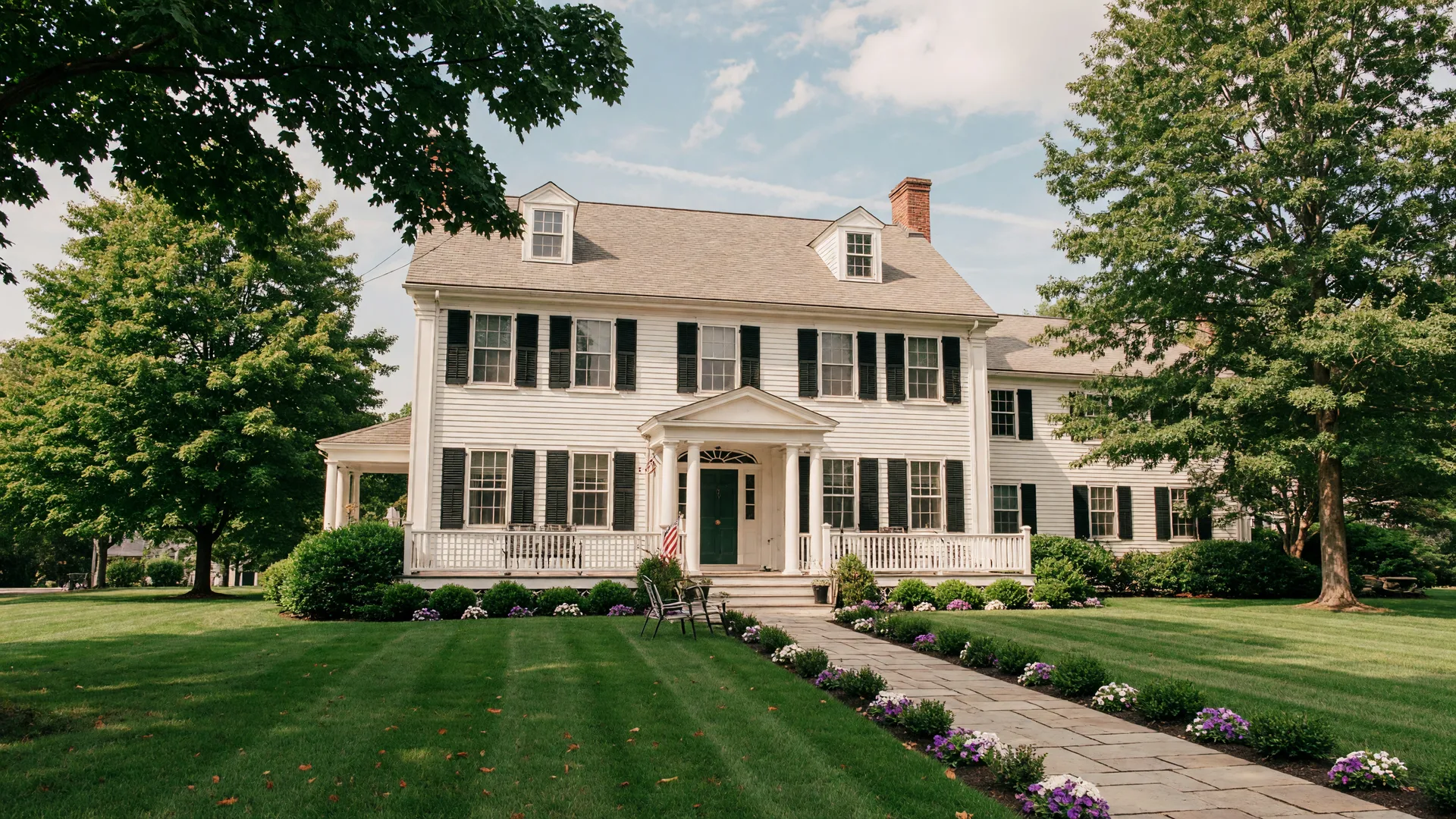Stately Connecticut colonial home with manicured lawn