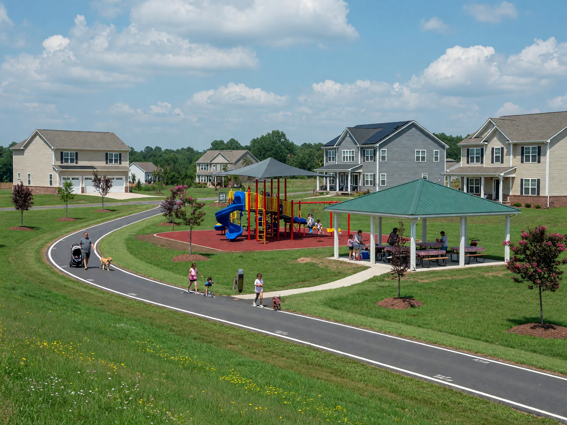 Modern community park with walking trail, playground, and new homes in a master-planned Stafford County neighborhood