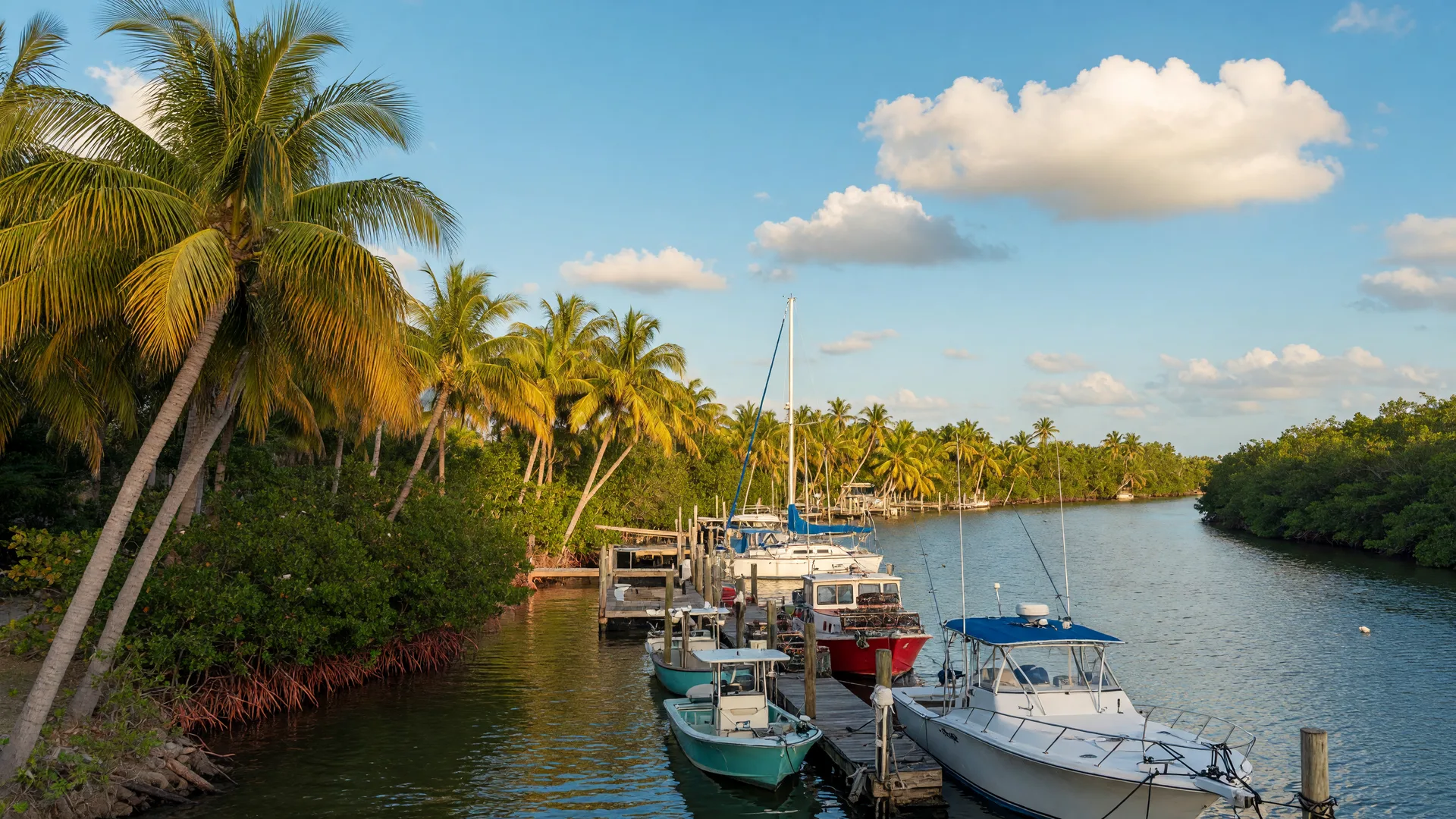 Bonita Springs marina with boats along the Imperial River on a sunny afternoon