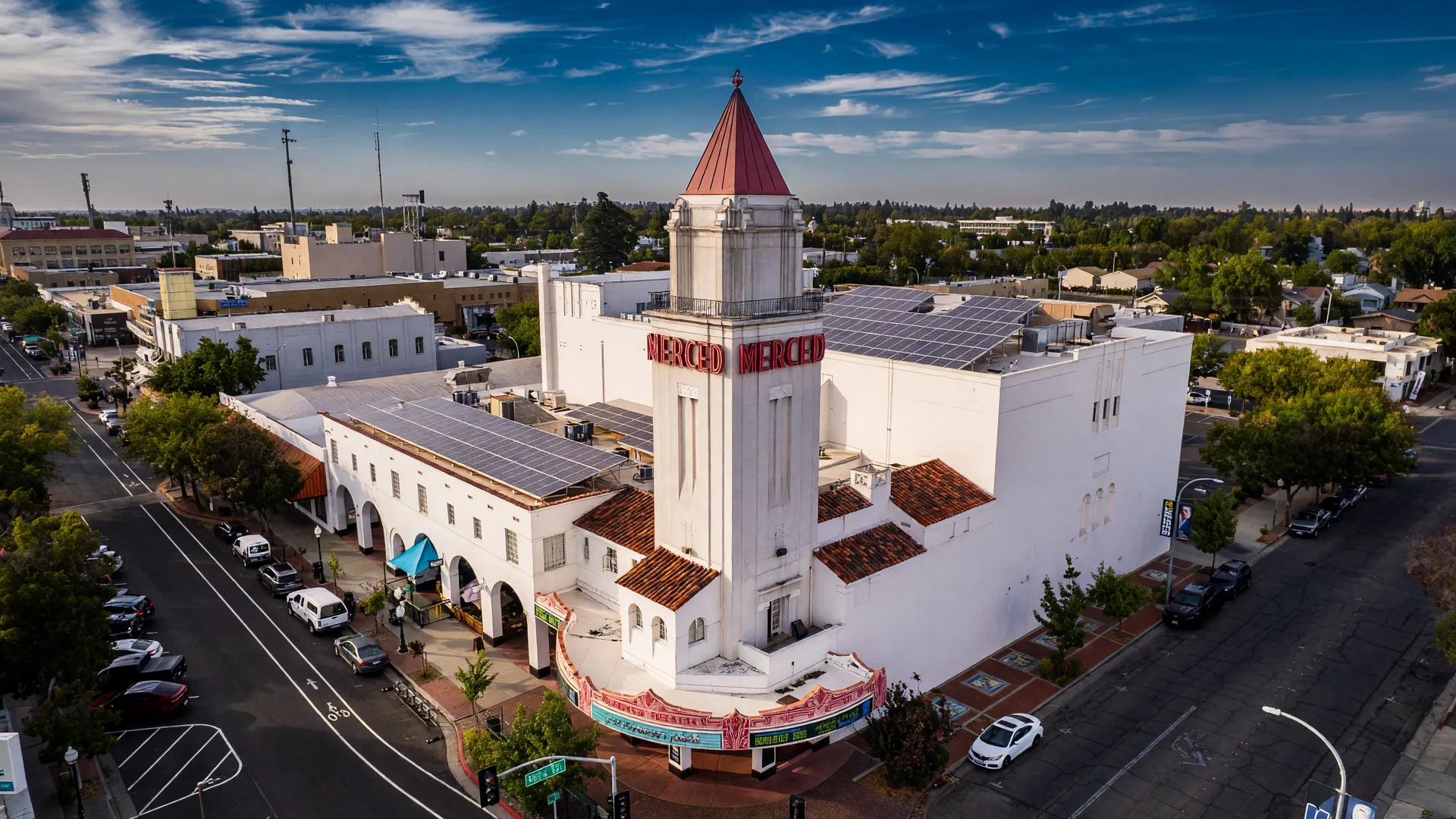 Aerial view of the historic Merced Theatre in downtown Merced, California with the surrounding streets