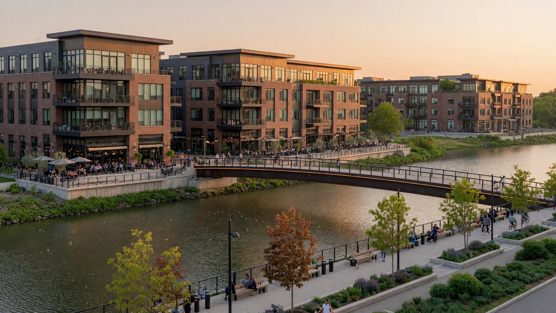 Bridge Park district in Dublin Ohio with modern riverfront buildings along the Scioto River at golden hour