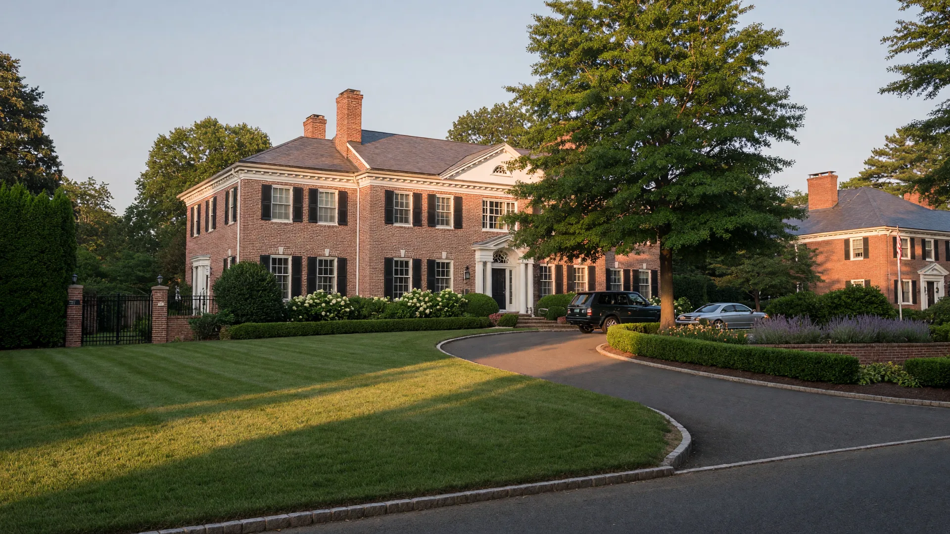 Luxury colonial home in Cherry Hill with manicured landscaping and circular driveway