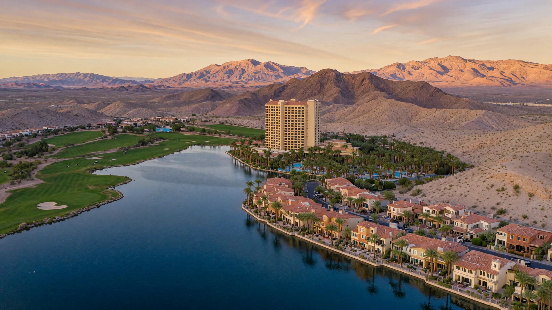 Aerial view of Lake Las Vegas with the man-made lake, Mediterranean village, resort hotels, and golf fairways framed by desert mountains