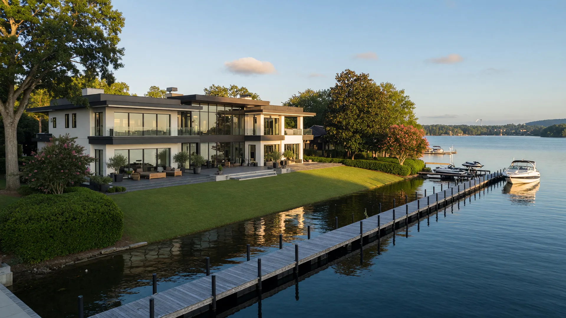 Luxury waterfront estate on Lake Norman with a private dock in late-summer morning light