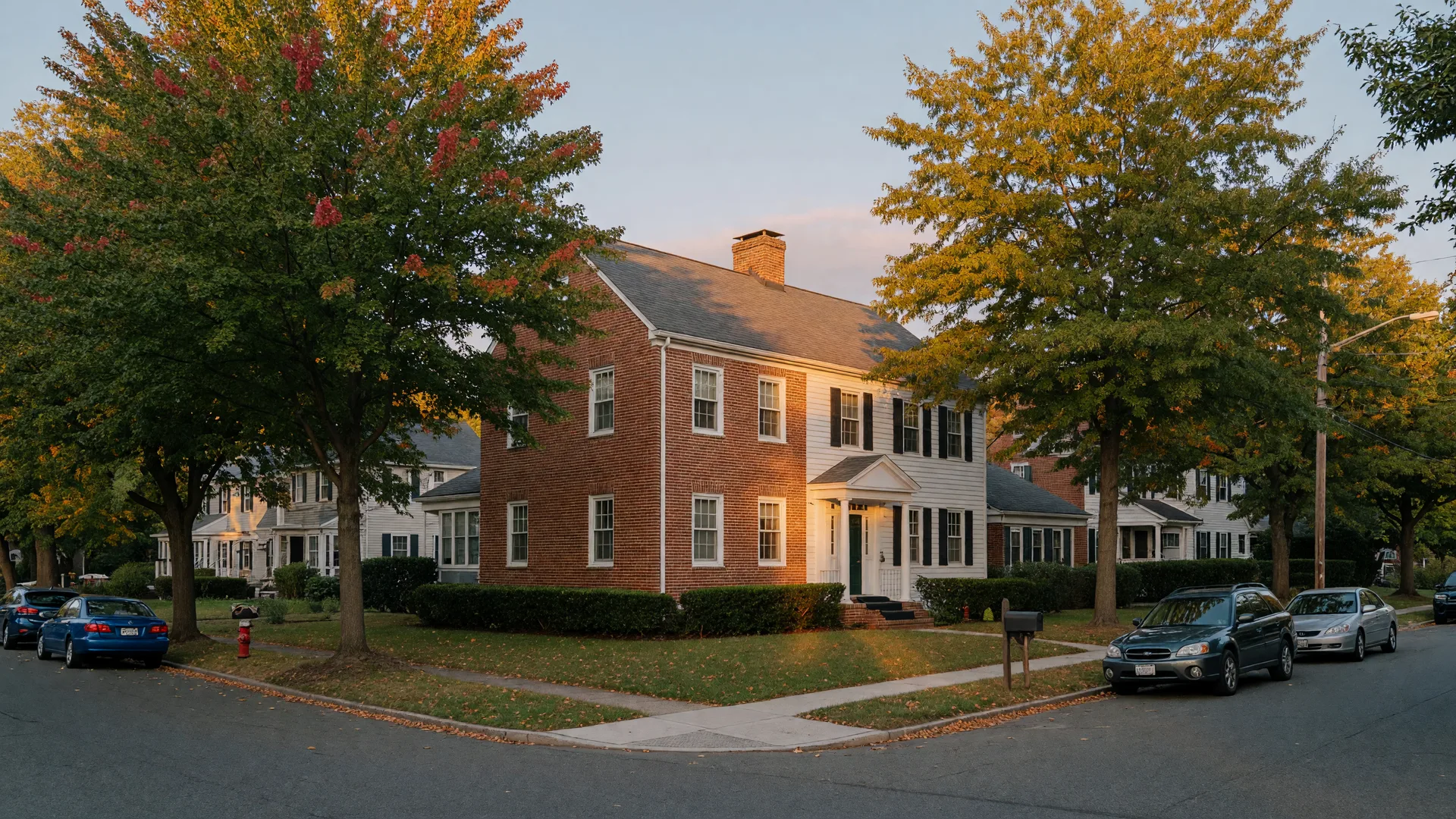 Colonial home on a tree-lined Cherry Hill street in golden early-fall light