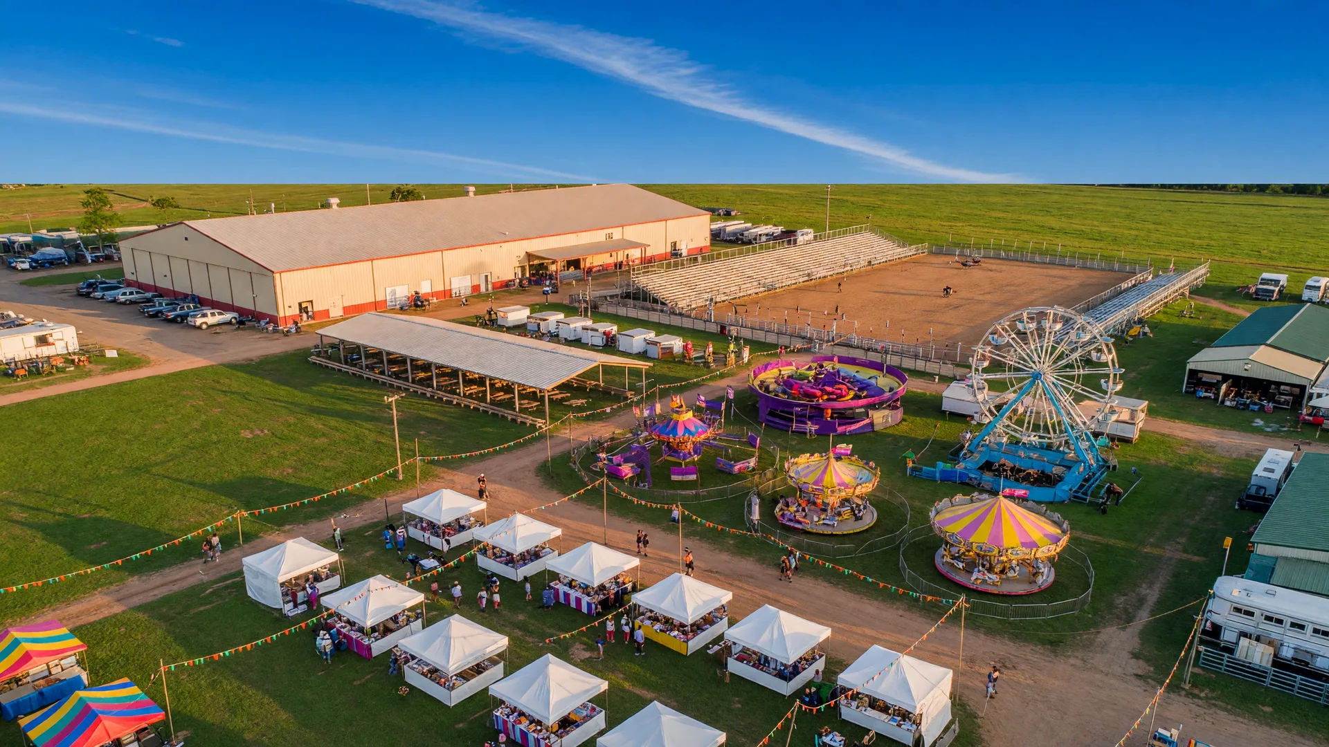 Washington County Fairgrounds in Brenham, Texas with carnival rides and exhibition halls
