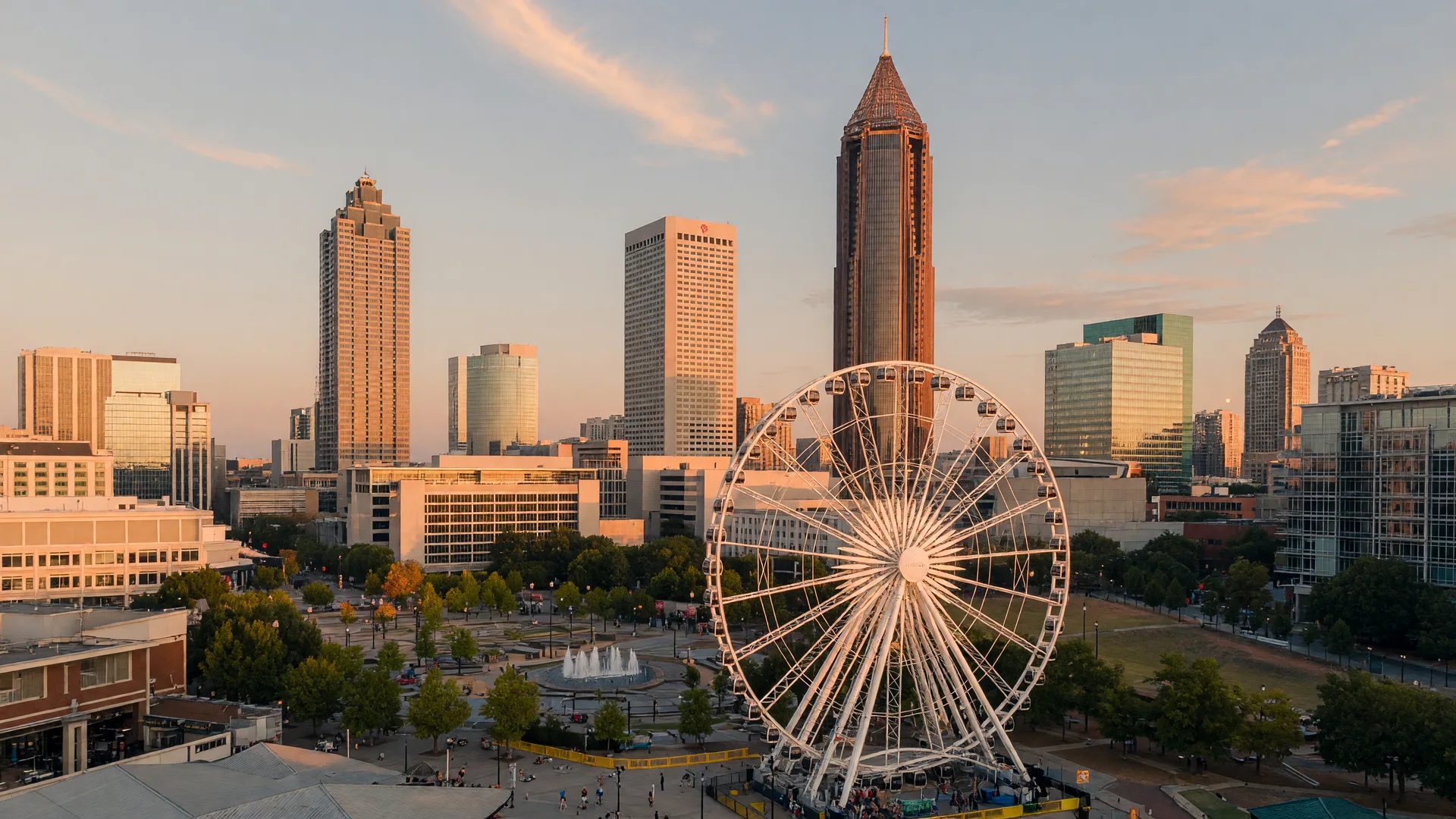 The downtown Atlanta skyline at golden hour with the Centennial Olympic Park district and the SkyView ferris wheel