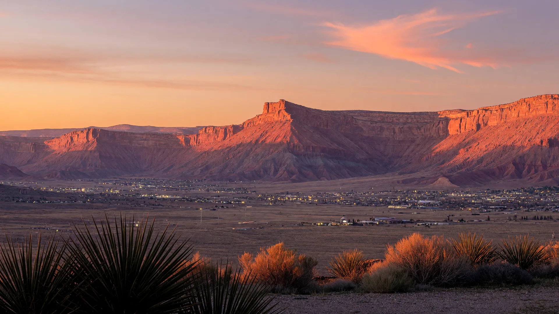 AI-rendered concept panorama of the St. George area and red rock mesas at golden hour