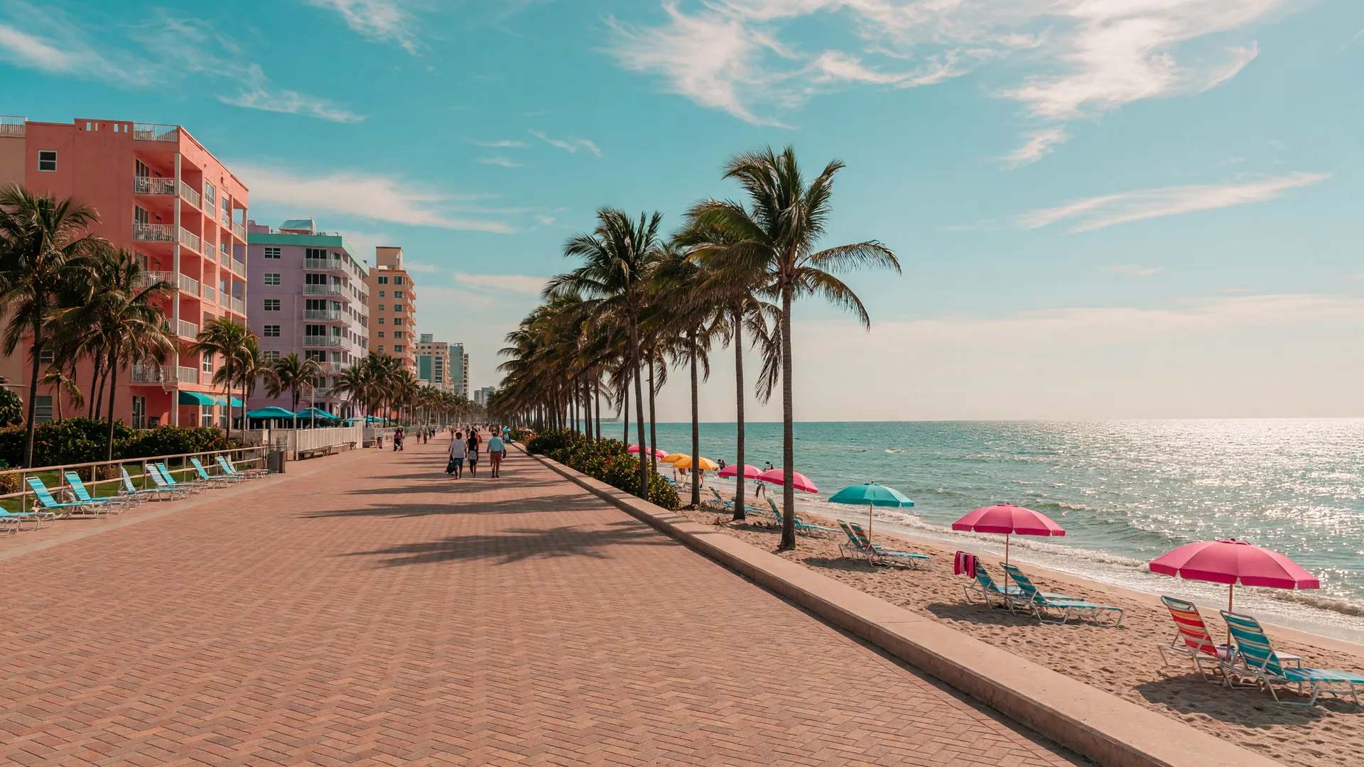 The Hollywood Beach Broadwalk with palm trees, pastel hotels, and the Atlantic