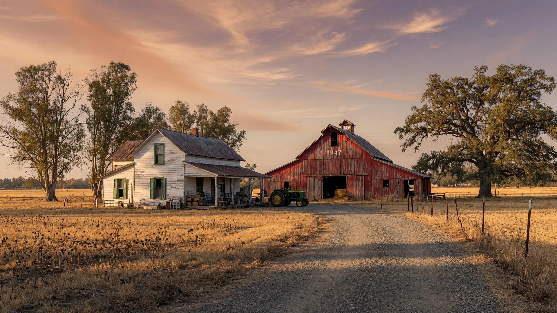 An older farmhouse and red barn on farmland outside Galt in late-afternoon light