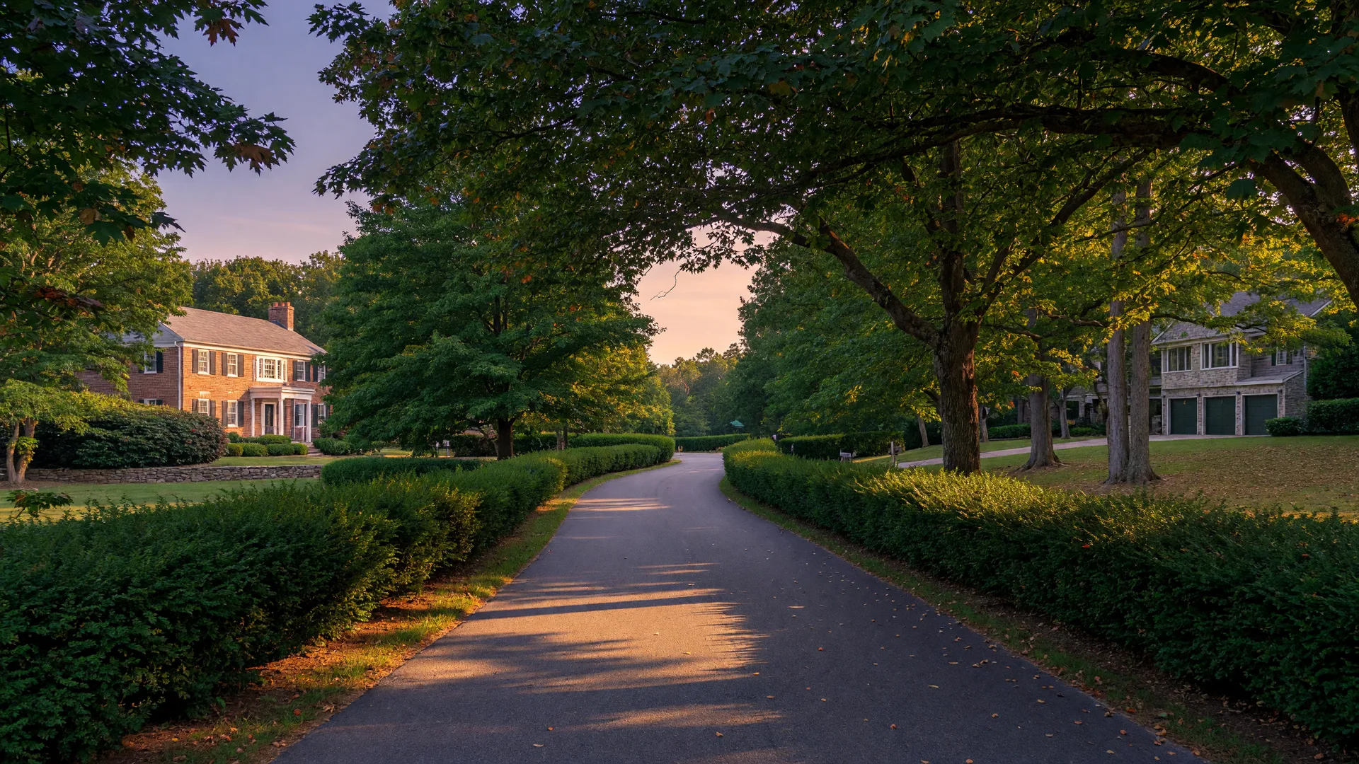 Quiet wooded residential street in Roseland NJ with large homes on leafy lots in golden afternoon light