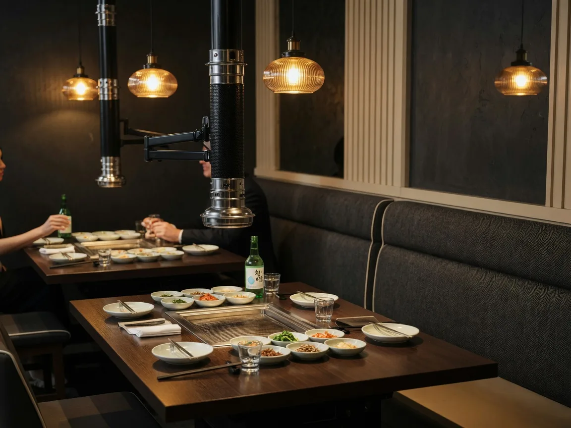 Refined Korean BBQ dining room at Korea Garden BBQ in Suwanee Georgia with tabletop grills and warm pendant lighting