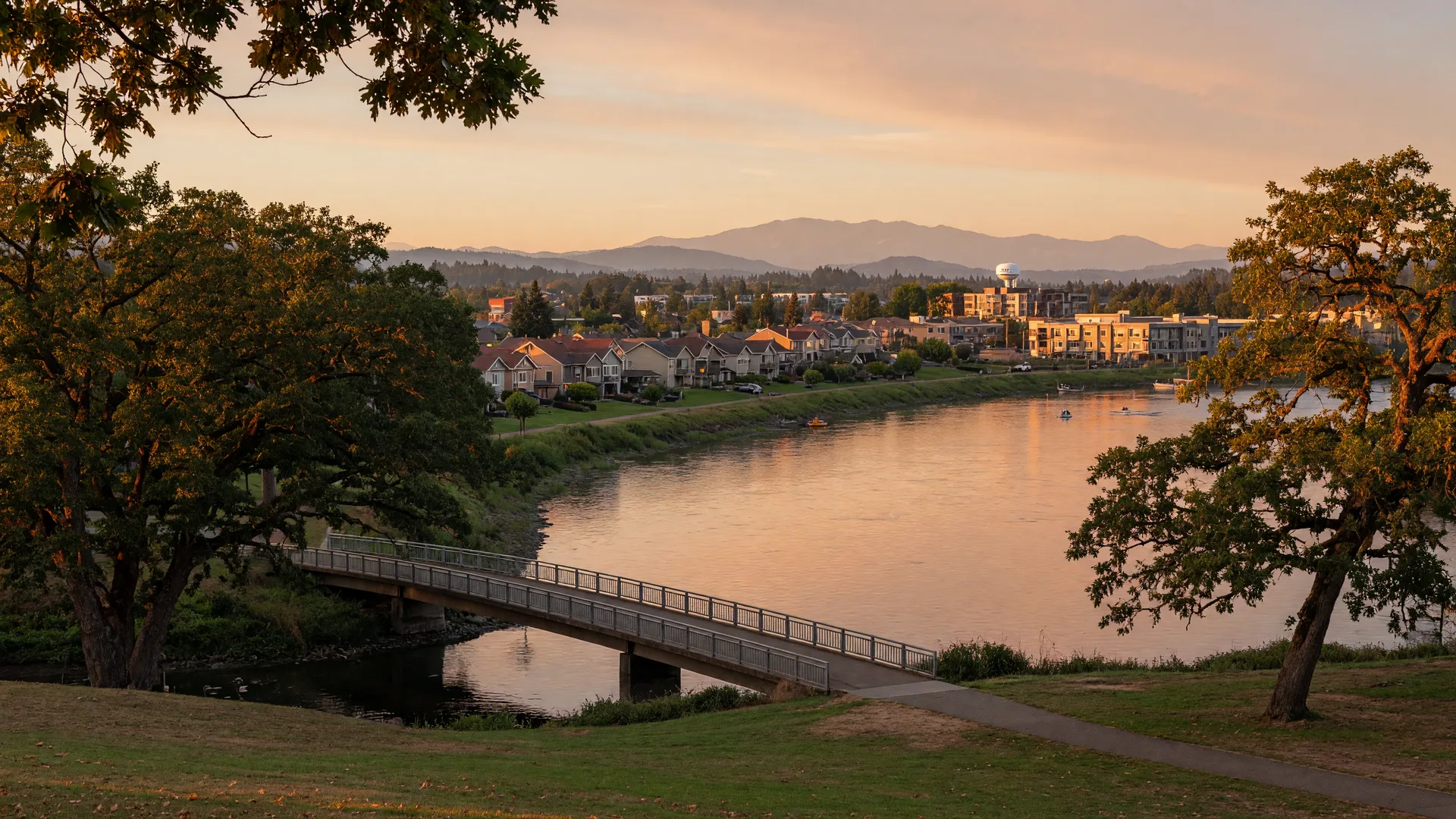 The Willamette River at Wilsonville at golden hour with the Boones Ferry riverfront parkland in the foreground