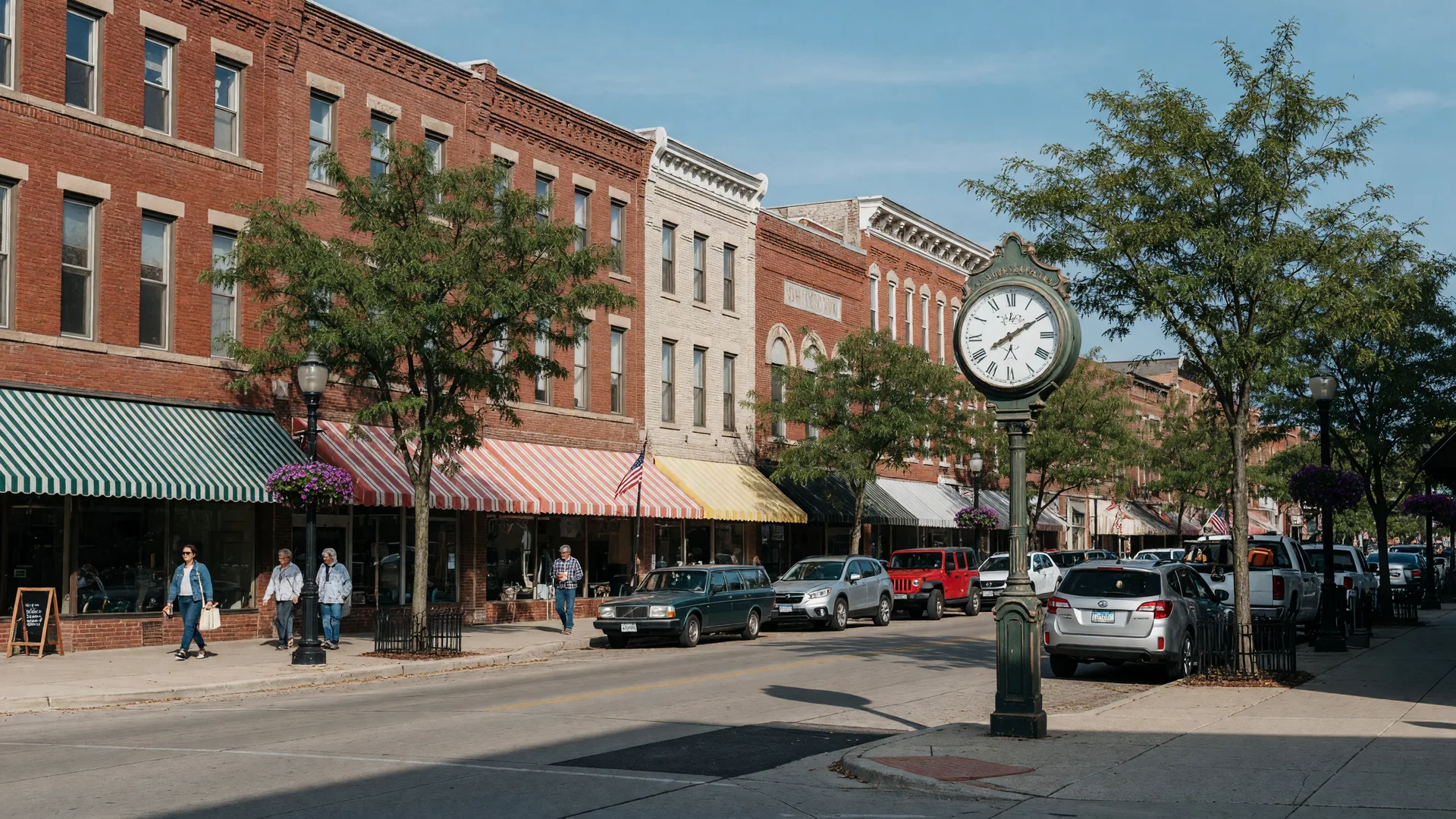 Historic brick storefronts and awnings along the main street of downtown Saline, Michigan