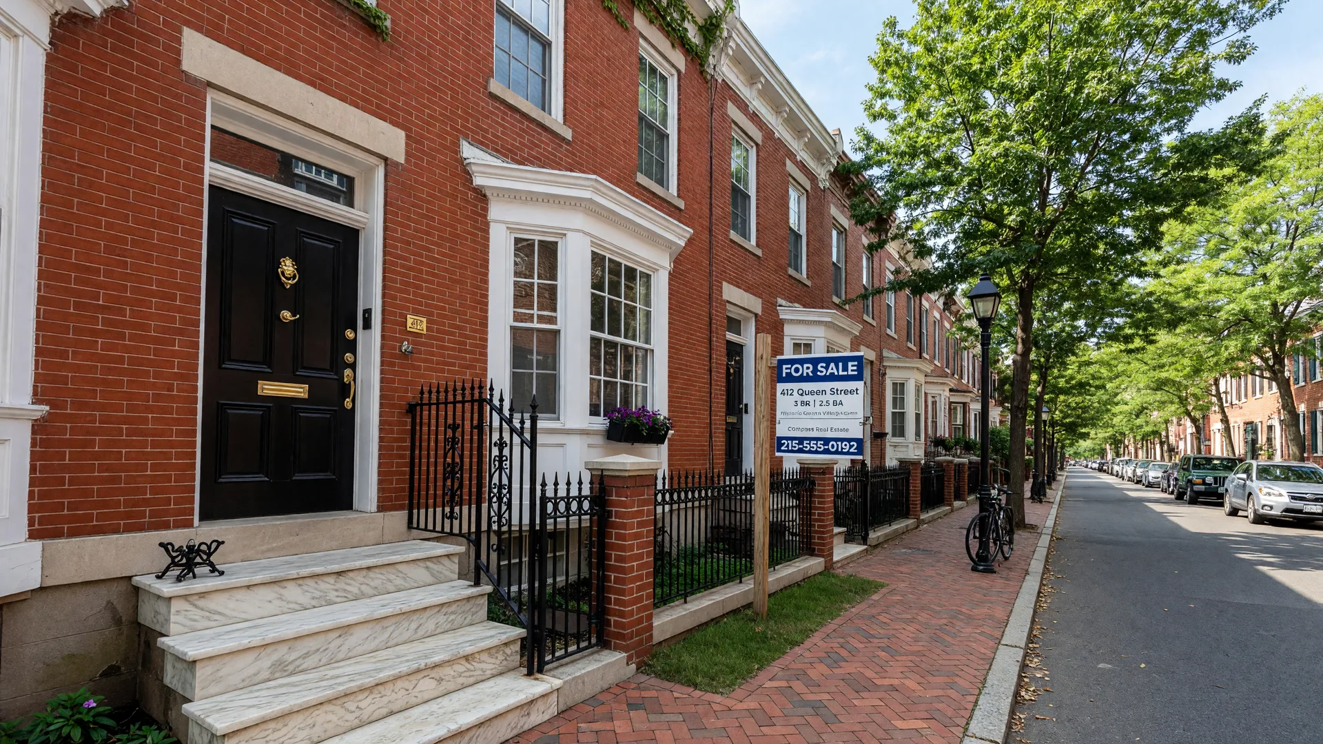 Historic brick rowhome with For Sale sign in Queen Village, Philadelphia