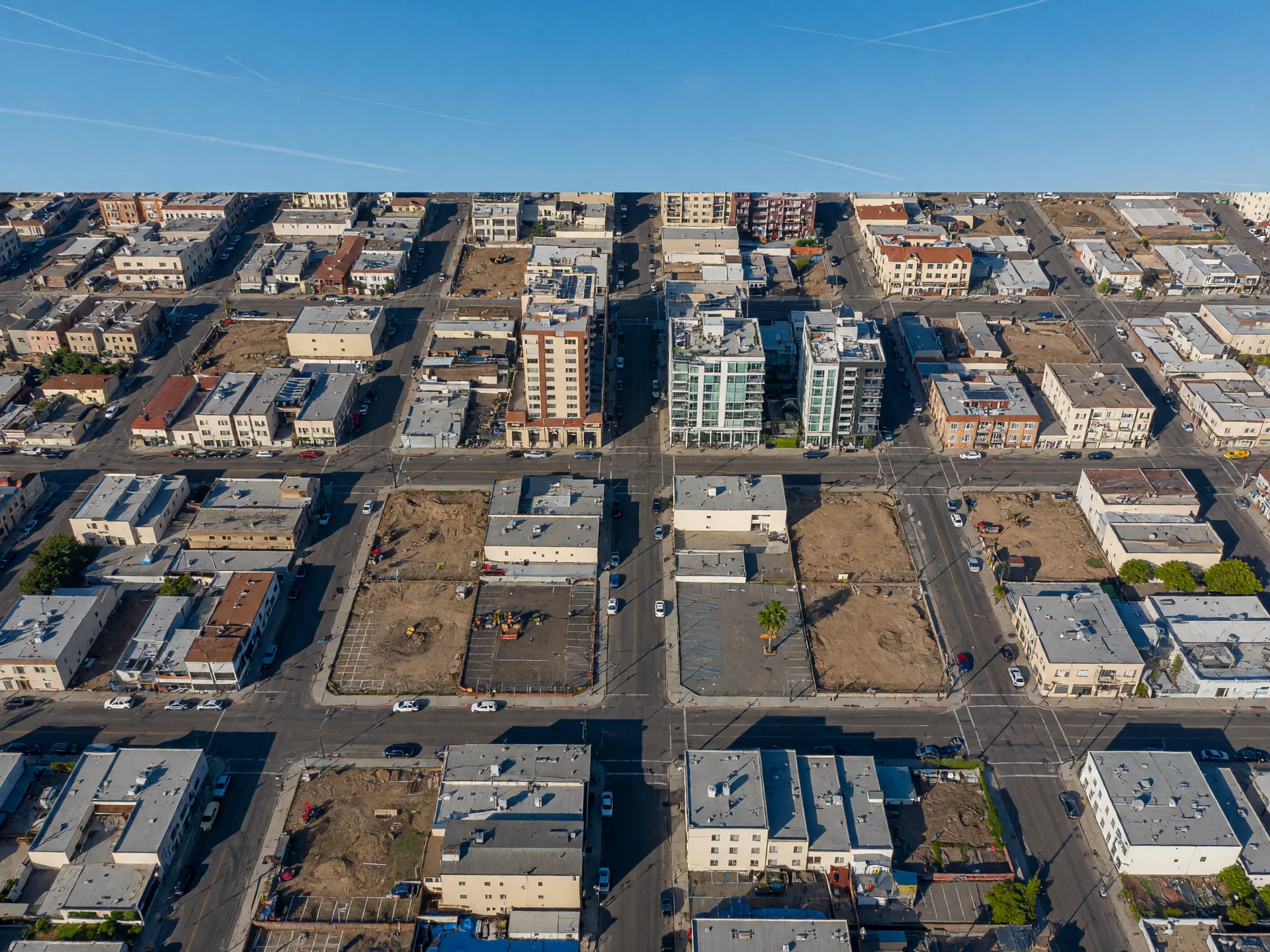 Aerial view of downtown San Diego showing the urban grid, development parcels, and mixed-use buildings in Opportunity Zone tracts