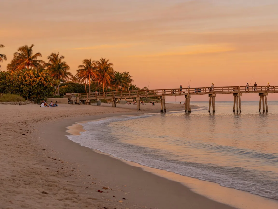 The Pompano Beach pier at golden hour, palms along the shoreline park