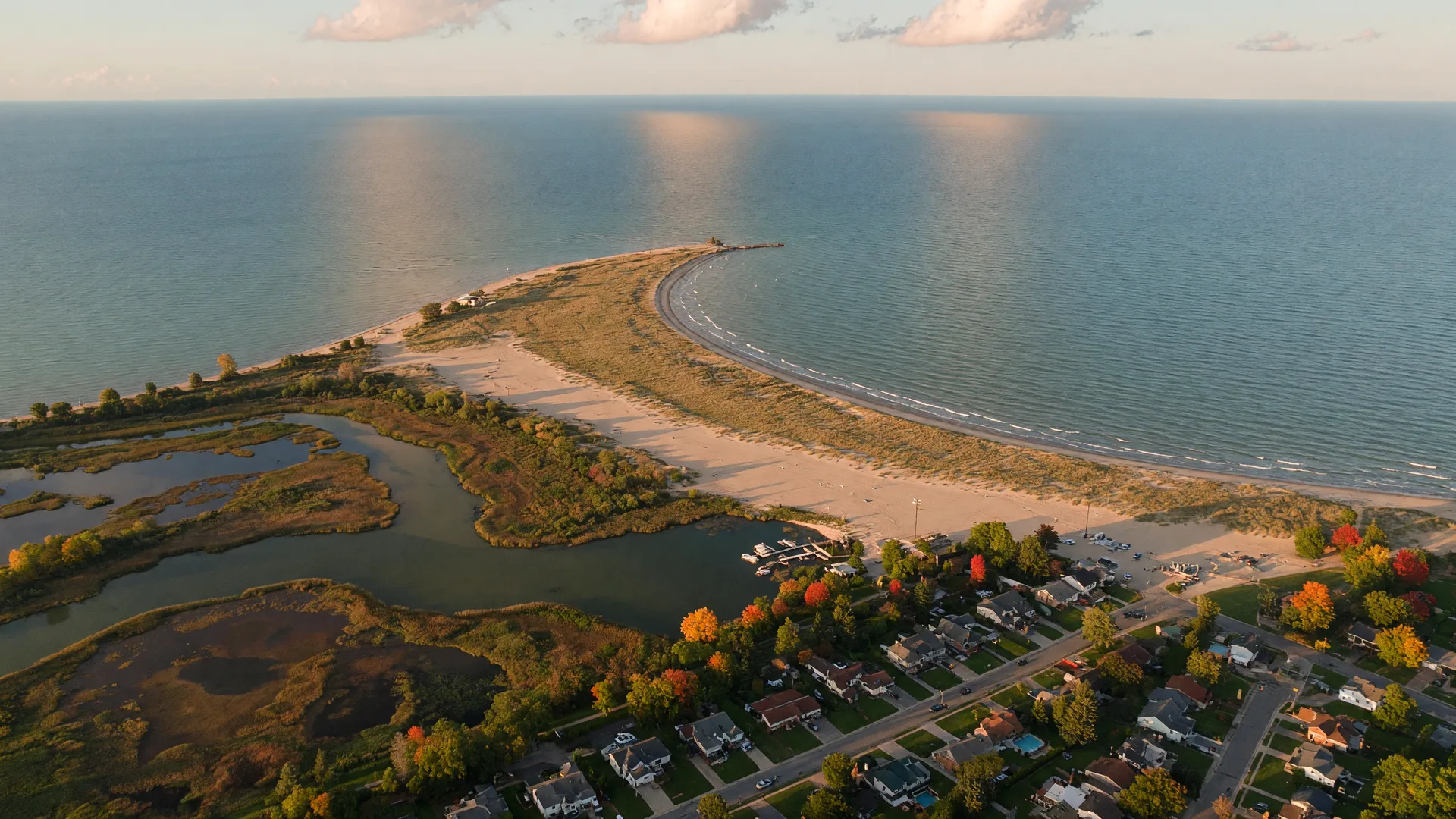Aerial view of the Lake Erie shoreline in Lake County, Ohio at golden hour with Headlands Beach and autumn trees