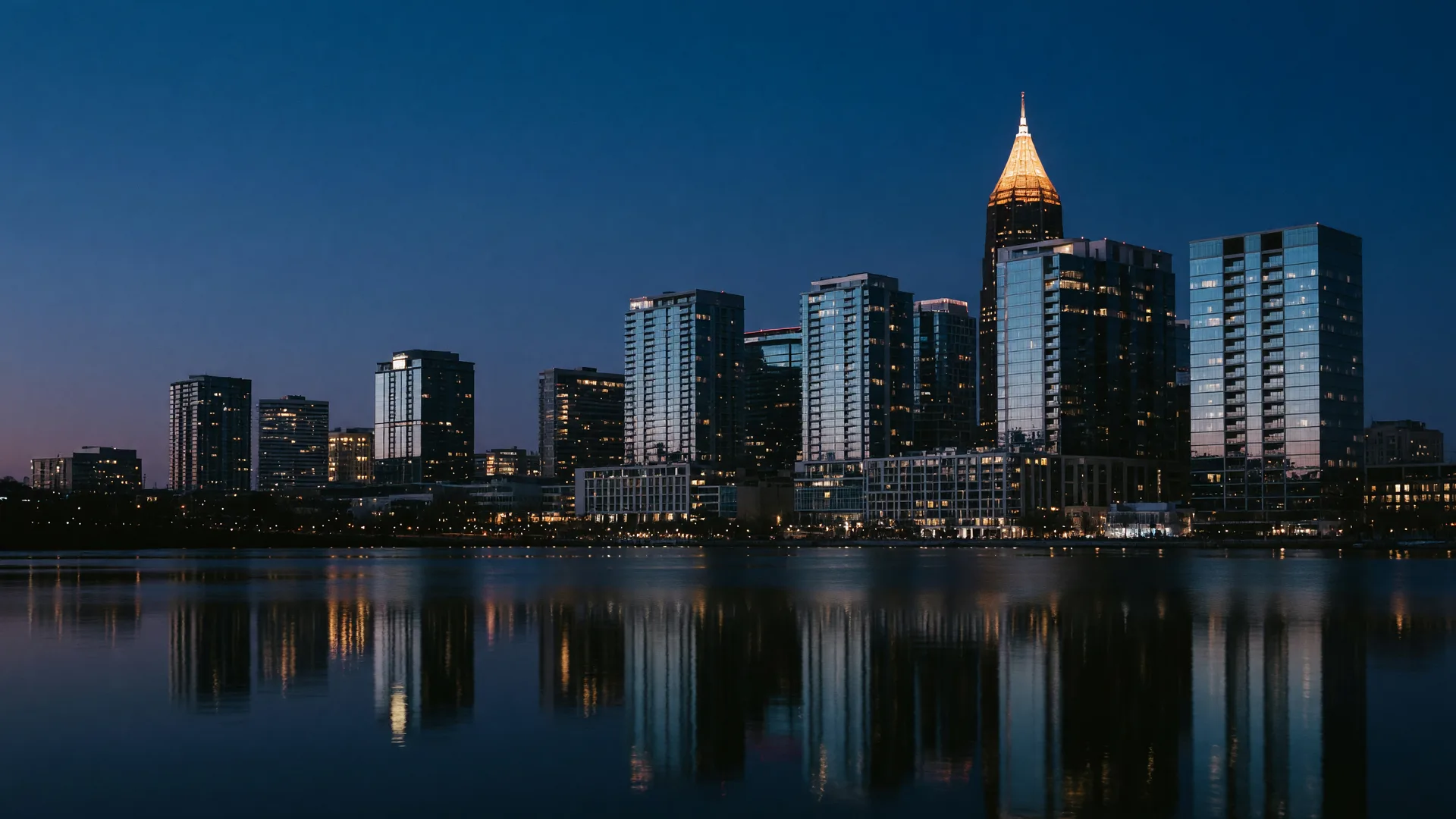 Atlanta skyline at blue hour seen across calm water