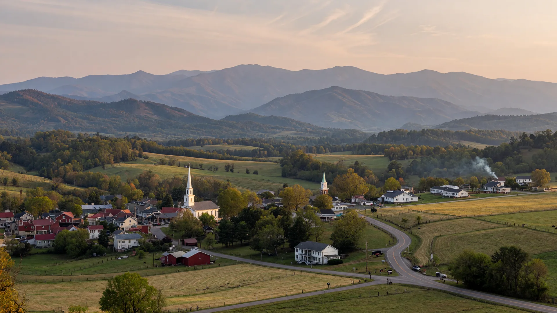 Foothills, farmland and a small mountain town in Sevier County, Tennessee, with the Smoky Mountains in the distance