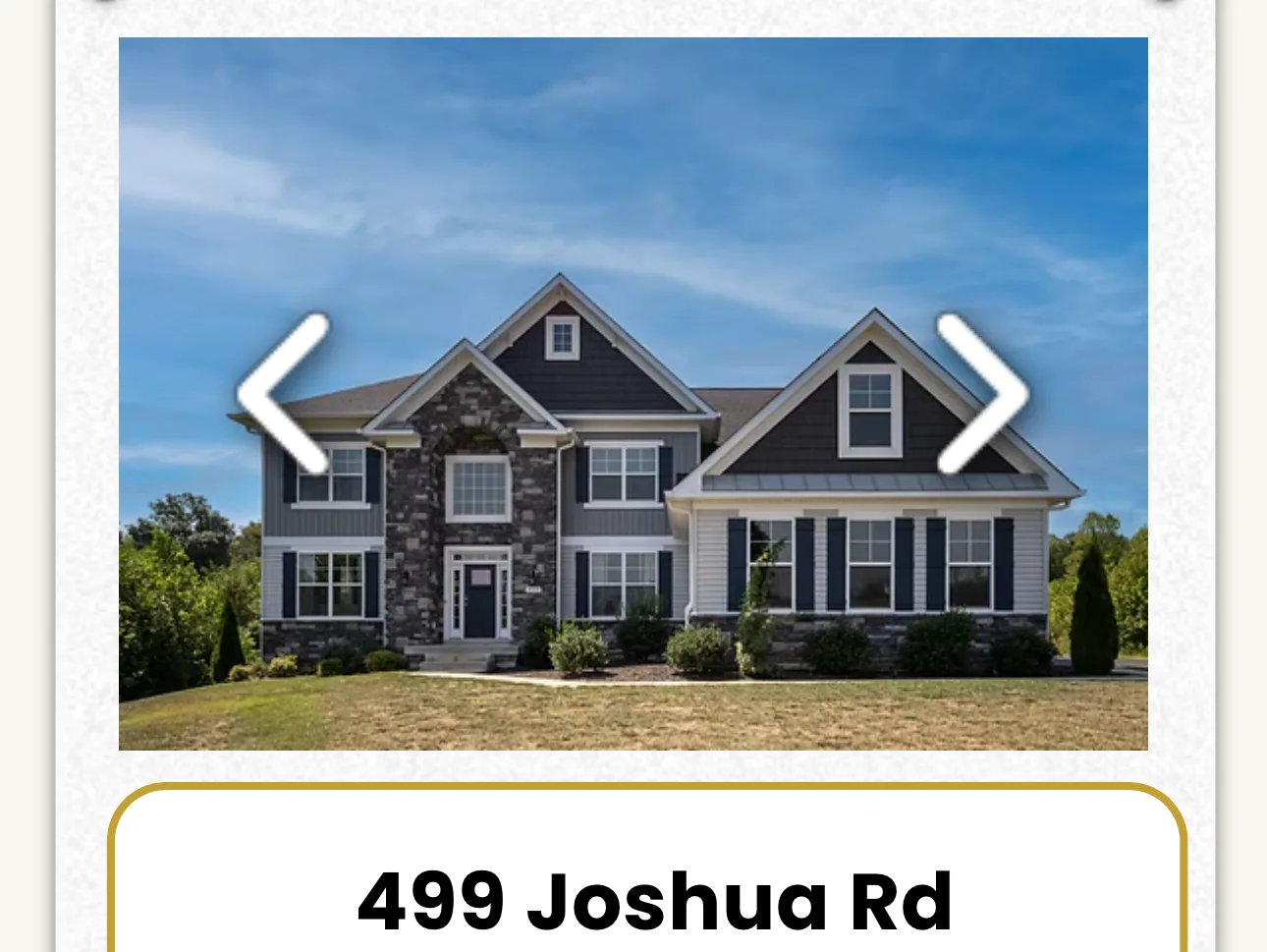 Front exterior of a newly built Craftsman-style home with stone accents and a covered porch in a Virginia new construction community