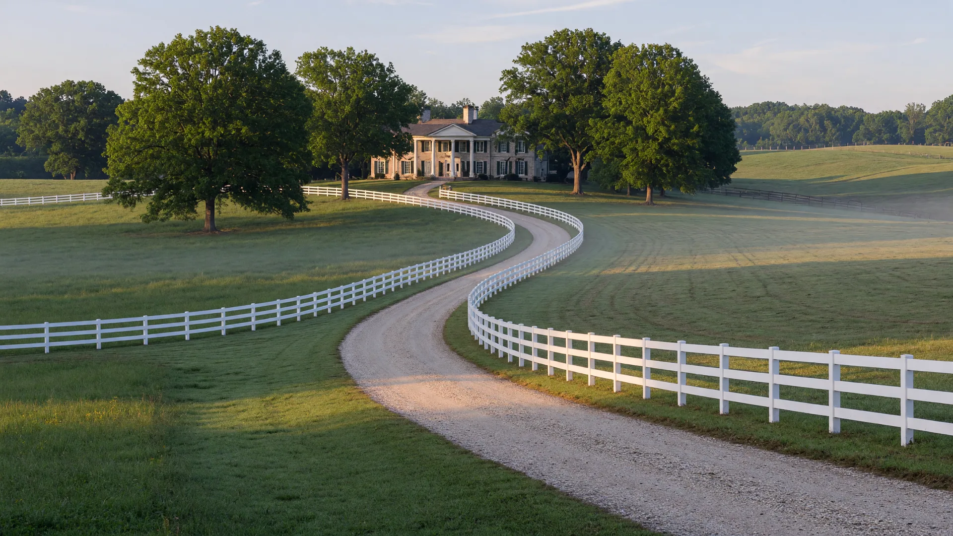 Countryside estate lane with white fencing near Marvin, North Carolina at morning