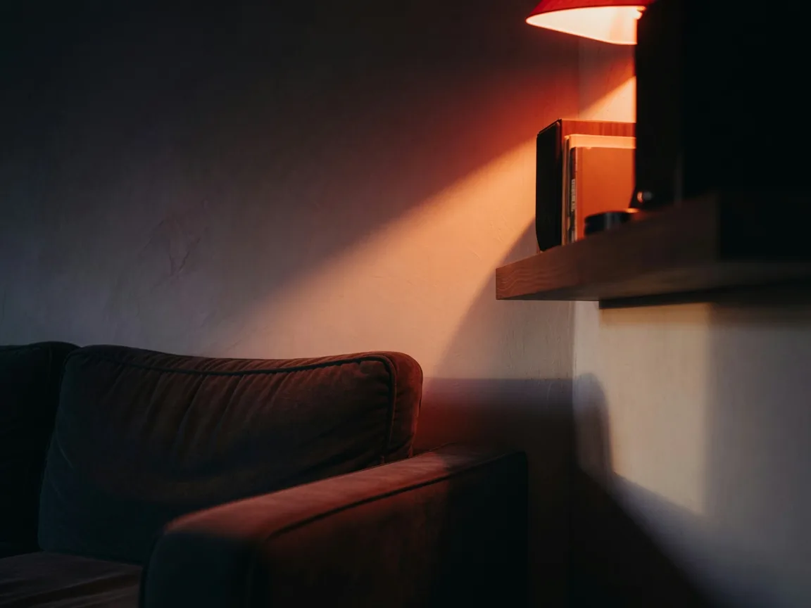 Lamp-lit interior corner of a Central Florida home at night